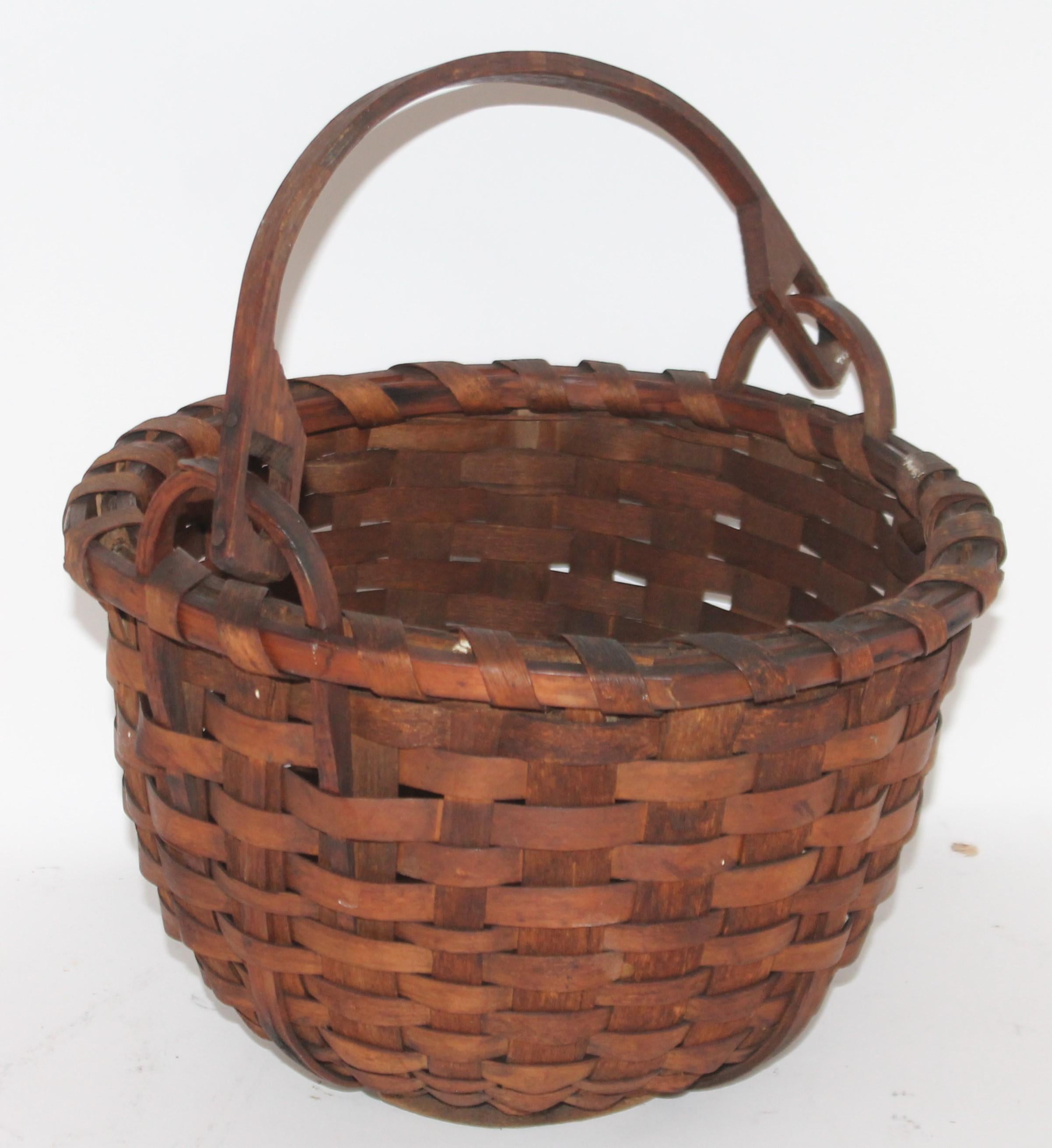 19th century early New England swing handled basket in amazing as found condition. This basket has a wonderful mello patina.
Basket with handle up and open measures
13 width x 12 diameter x 15 high
Handle down the basket measures
12 width x 12