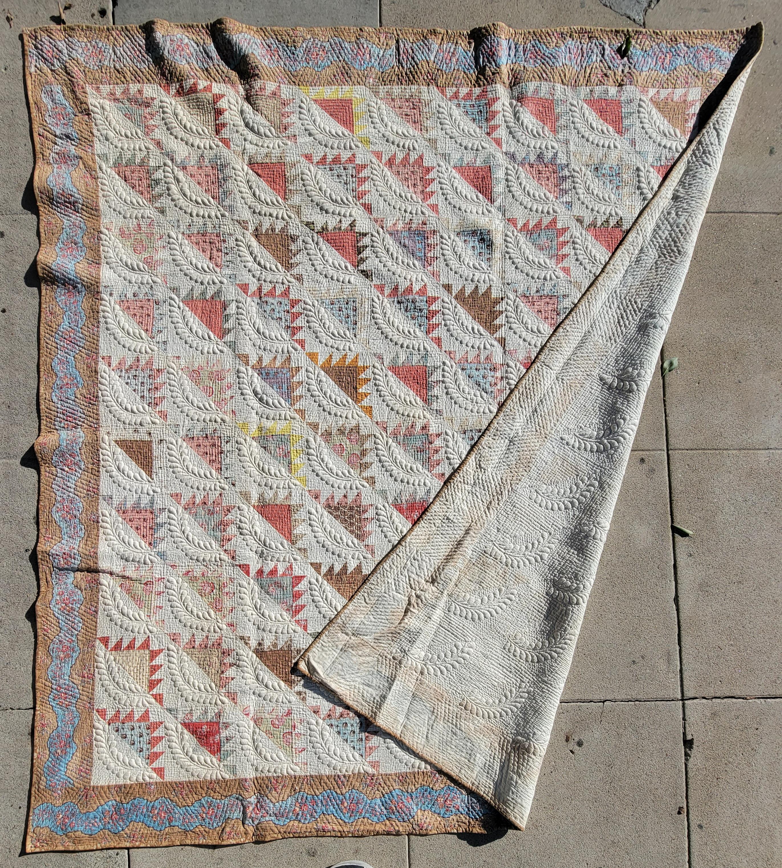 This fine and amazing 19thc New England trapunto & chintz quilts has a fantastic robin egg blue chintz calico border.This delectable mountain pattern quilt is really in fine pristine and comes to us from a private 50 years of collecting old quilt