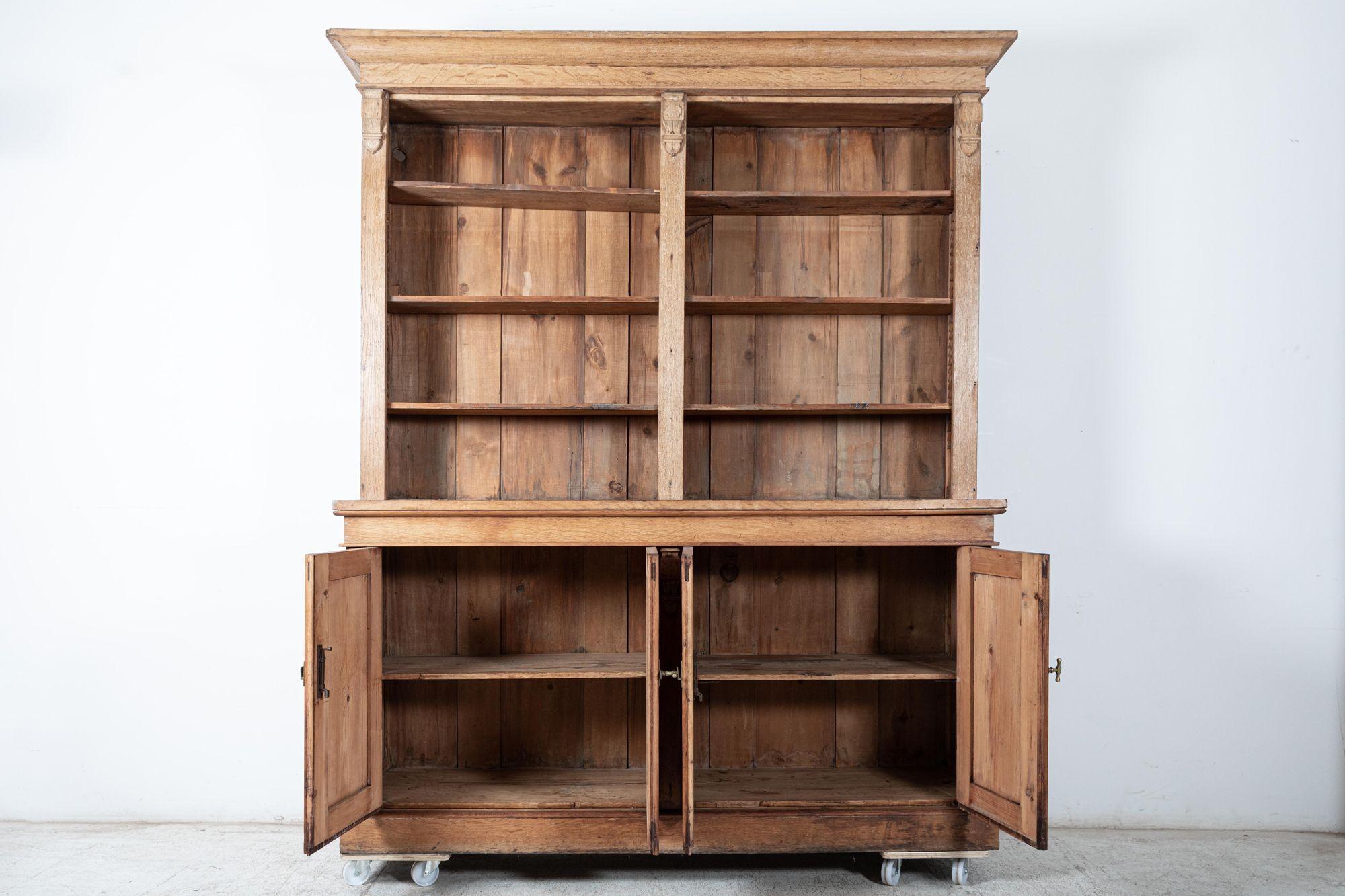 Circa 1870

19thC oak & pine open bookcase / dresser with original brass T bar handles and hardware.

(2 parts)

Measures: W 190 x D 47 x H 228 cm

Base W 181 x D 47 x H 96 cm
Top W 190 x D 36 x H 132 cm.

     
