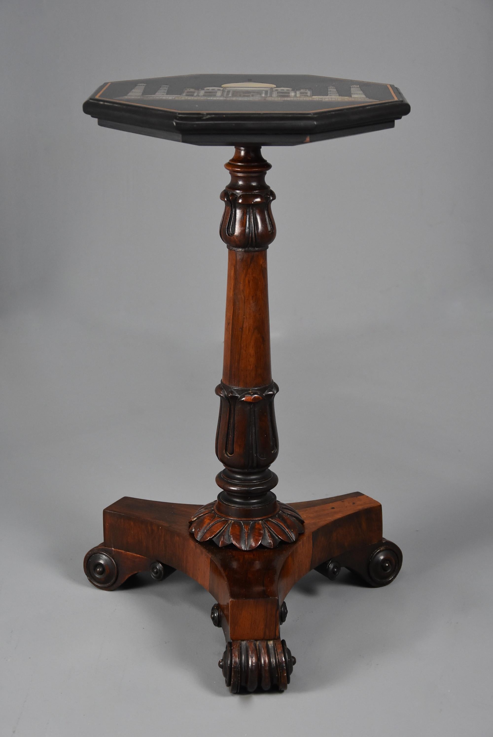 A 19th century (circa 1830) occasional table with highly decorative octagonal polished slate top with finely inlaid and engraved mother of pearl design of the Taj Mahal with inlaid stringing and moulded edge.

The top is supported by a tri-form