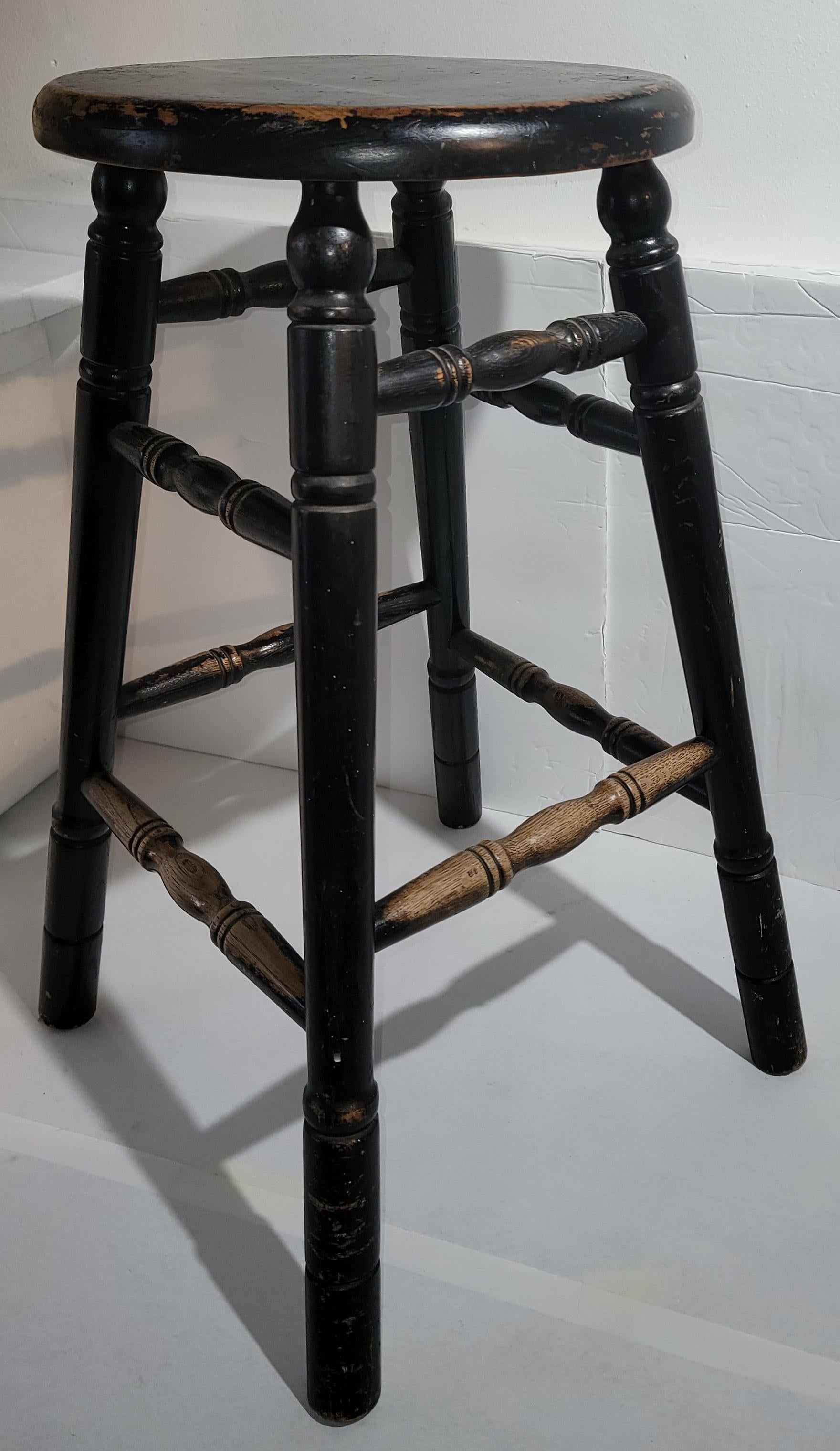19thc Original black painted bar stool is in fine sturdy condition.This aged and worn paint is consistent from age and use.