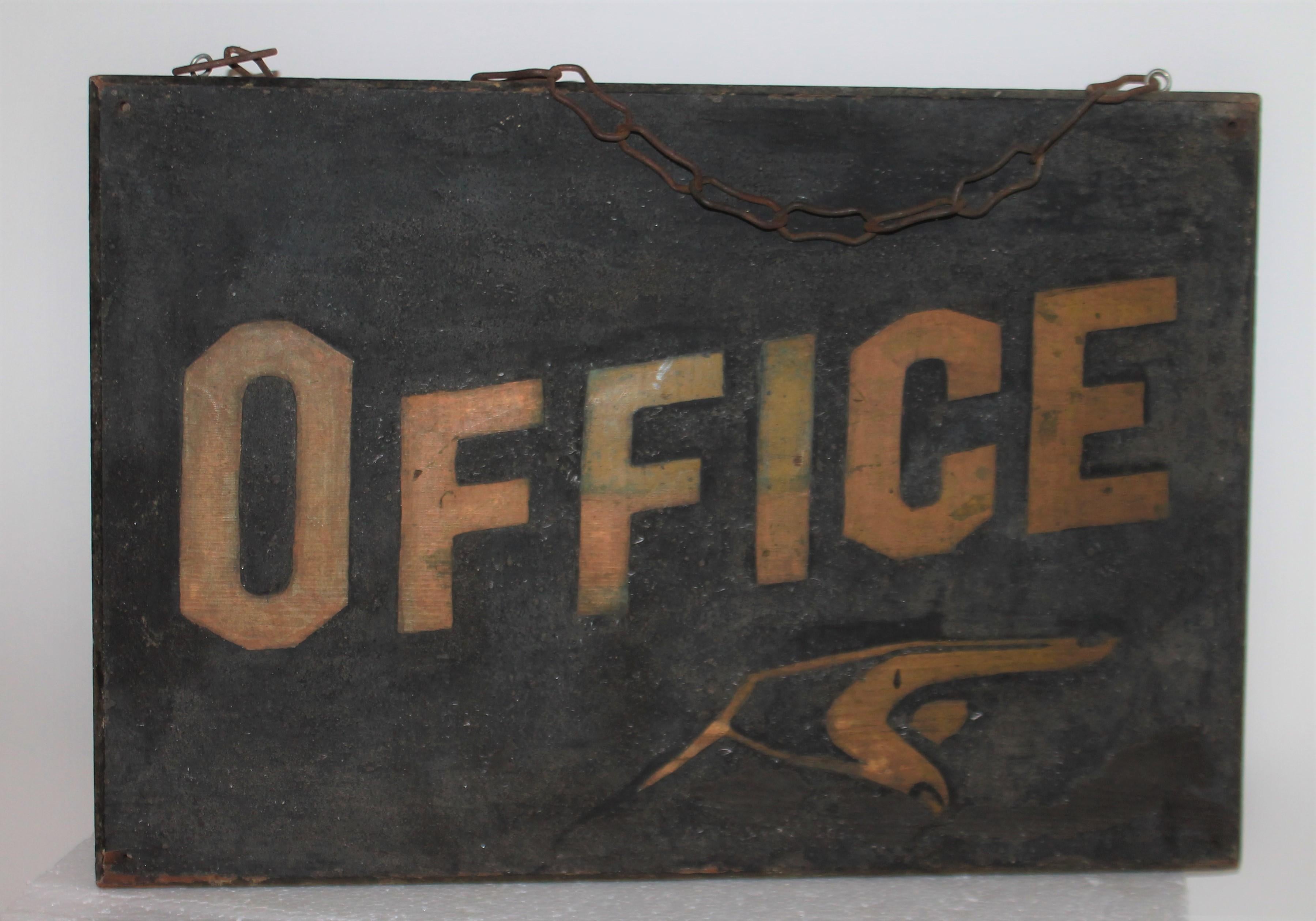 This folky trade sign is hand made with all original black sand paint and original gilded letters. It is one sided with the original iron chain for hanging. This was found in the state of Maine.