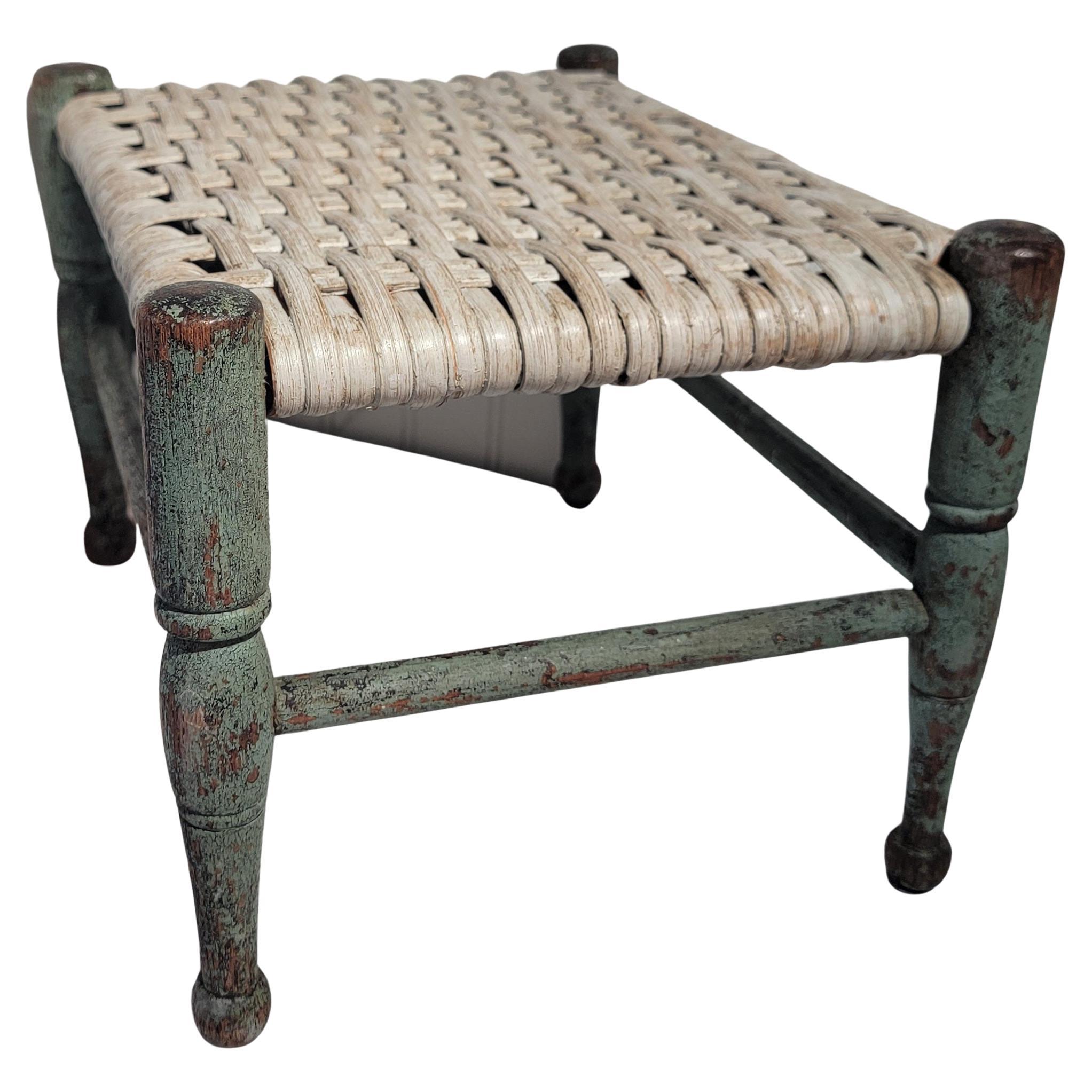 19Thc Original blue painted foot stool from New England.The original woven splint top is in a original white washed painted surface.The condition of this stool is in pristine condition.Amazing undisturbed surface.