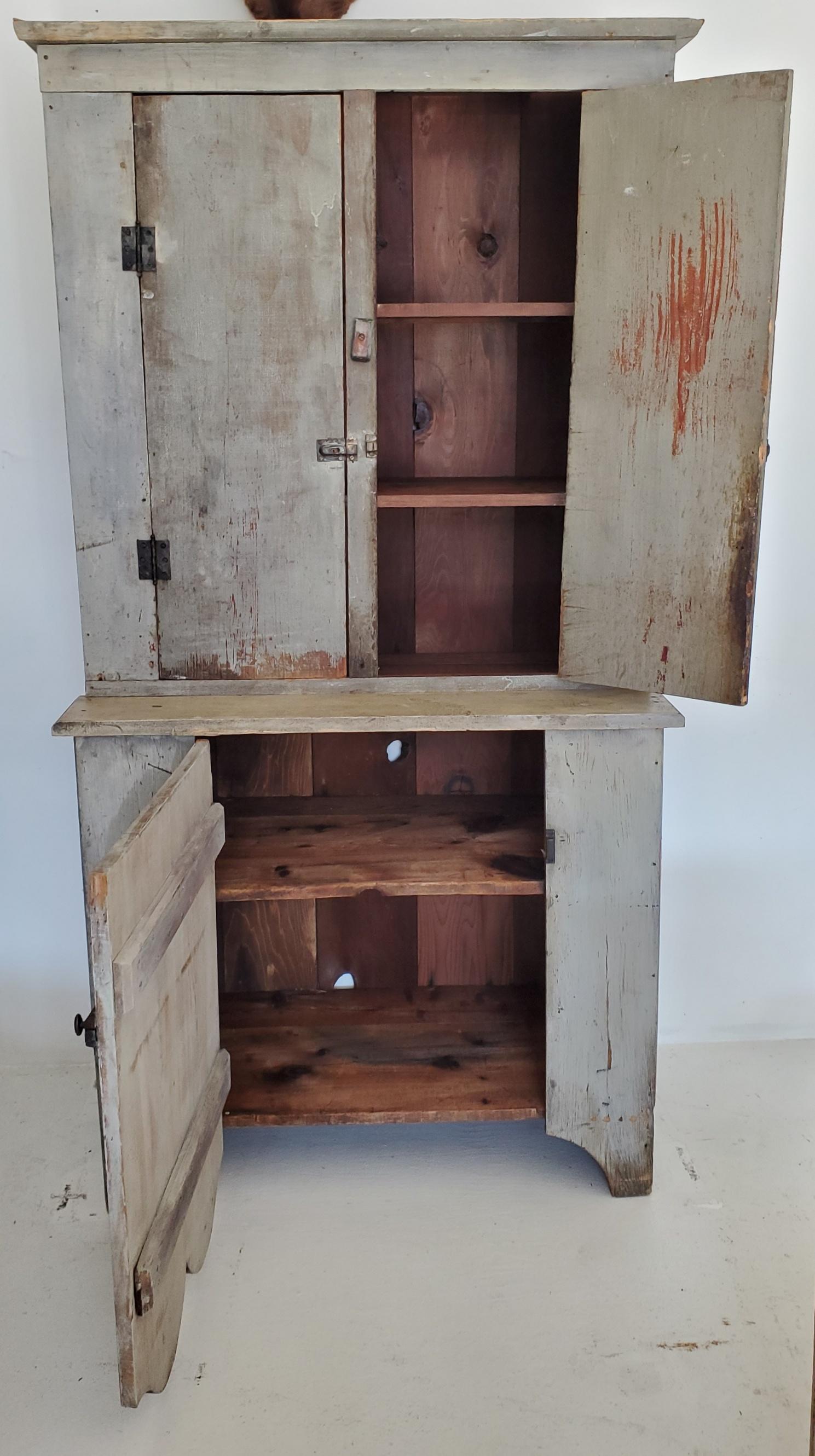 19thc original blue painted wall cupboard from Tennessee. The hardware is all original and looks straight off the farm. Condition is good with wear to the paint and edges.