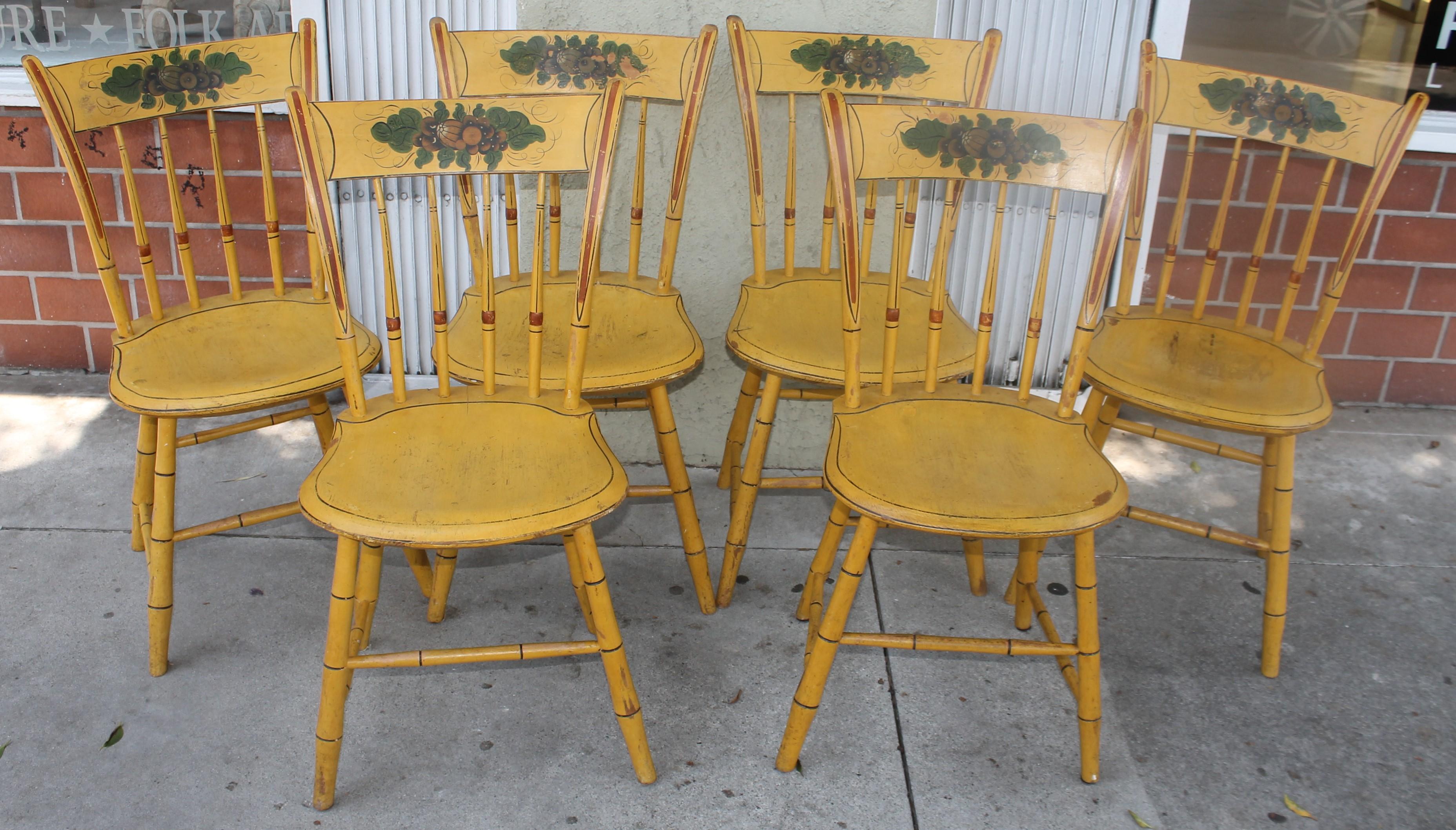 These fine original paint decorated thumb back New England Windsor chairs are in amazing sturdy condition. The painted decorated splash is amazing painted details. The seats may have been touched up by the previous collector. The condition of these