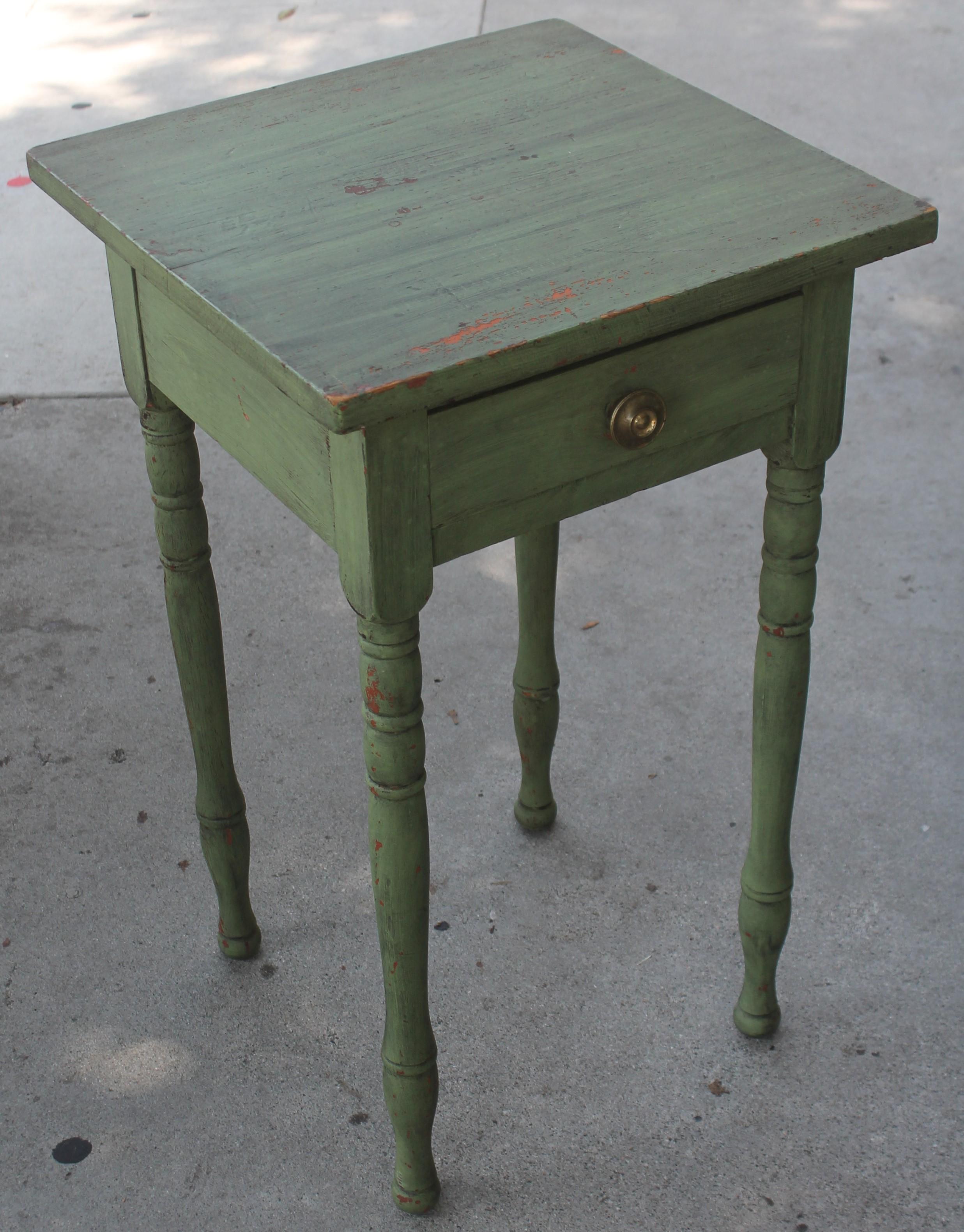 19thc original green painted one drawer stand in fantastic condition. This was found in a collection in Lancaster County, Pennsylvania. Amazing green over red painted surface.