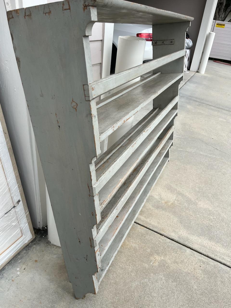 This amazing 19thc original grey painted hanging wall  plate rack with dovetailed case. This is in such fine condition and very hard to find the American plate rail.