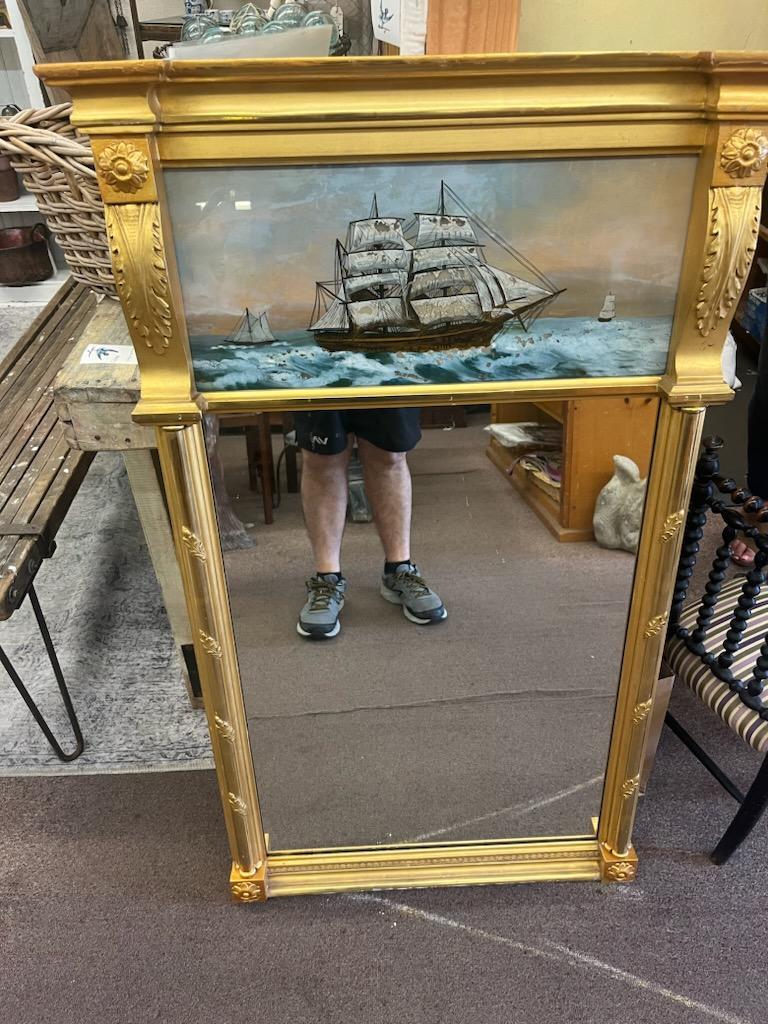 This amazing hand painted and gilded wall mirror is in amazing condition.With a lemon gold frame & reverse painted ship scene.This came from a gallery in Boston, Mass. Its a 19th century mirror and original frame too.

Edward t. Bacon
