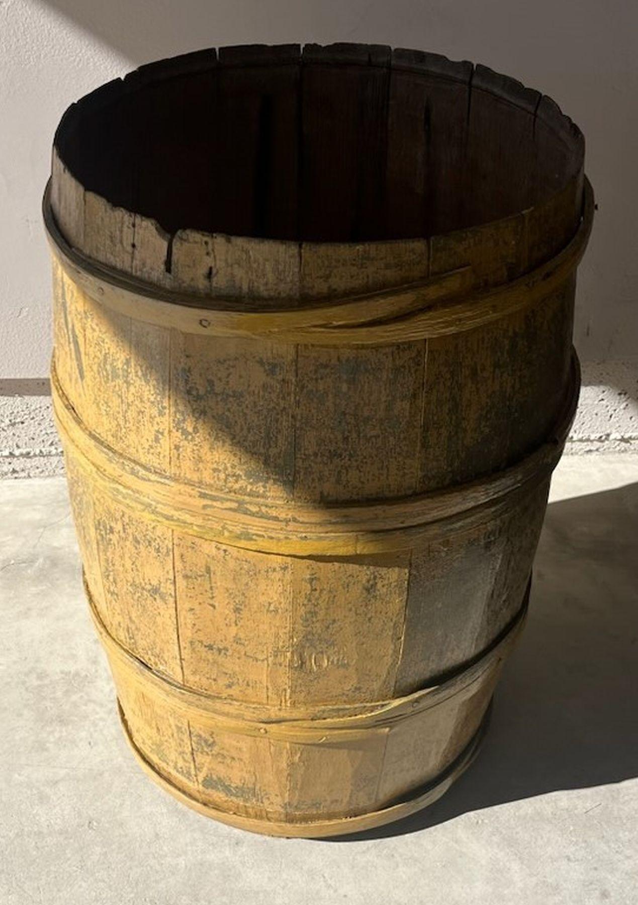 This folky original mustard painted over grey barrel was found on a farm in Pennsylvania. The condition is very good and sturdy. The patina is amazing and it has a outdoor protective coating for protection of bad weather.
