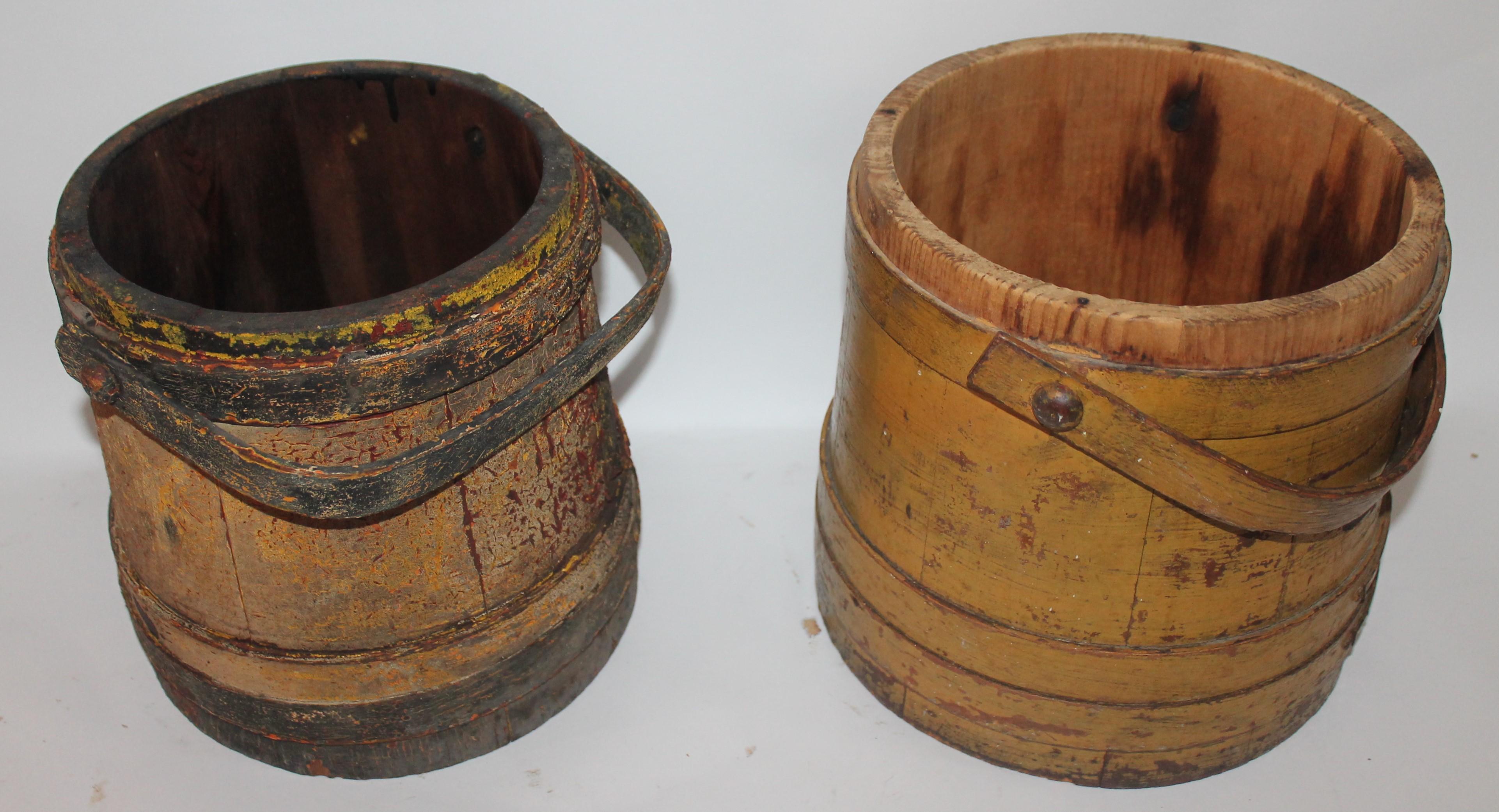 These two 19th century original painted handled buckets of furkins without lids. The condition are very good with amazing grungy untouched surface. Both buckets are tight and strong. Make fantastic trash containers or shelf models.

Measures: