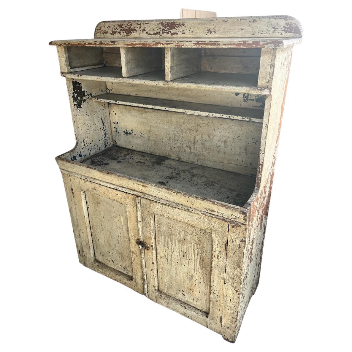 This fantastic original white painted dry sink was found in Ohio but we feel like it was made in Pennsylvania. The surface is all original with some minor paint loss but fantastic surface. This dry sink has been professionally waxed & restored.