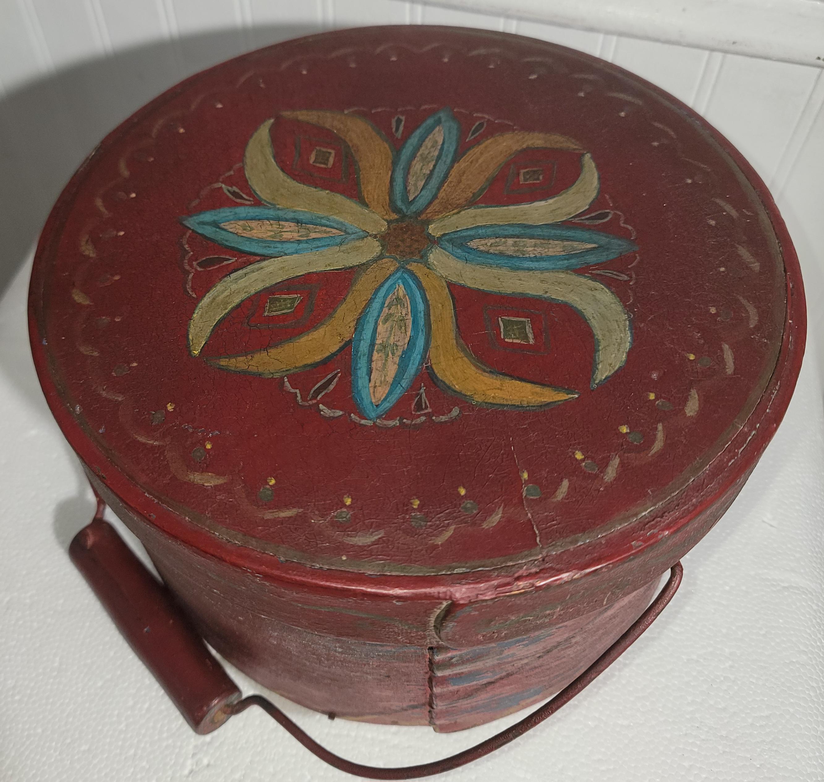 19Thc Original paint decorated red over blue swing handled pantry box from New England.This amazing over painted pantry box has wonderful 19thc decoration and is in good condition.