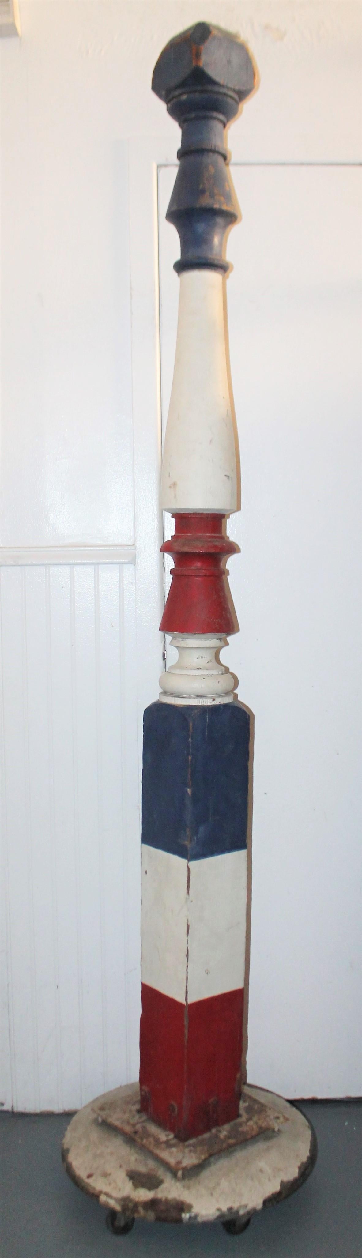 This funky barber pole was found in the mid west and retains its original painted surface. Painted Steve's name on the pole and iron base and wheels. Steve's I’m sure was painted years later but has age to it as well. The base is very cool and has