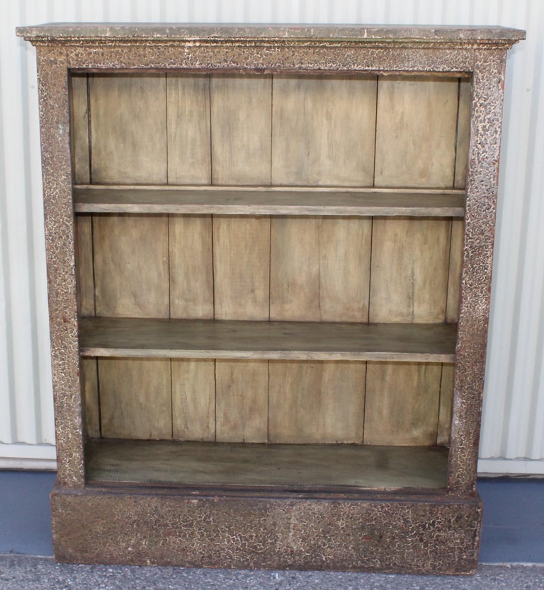 This grungy original painted sage green book or collectors shelf is in good sturdy condition. This shelf has a crackled or aligatored surface. Would be great filled with Folk Art or antique books.
