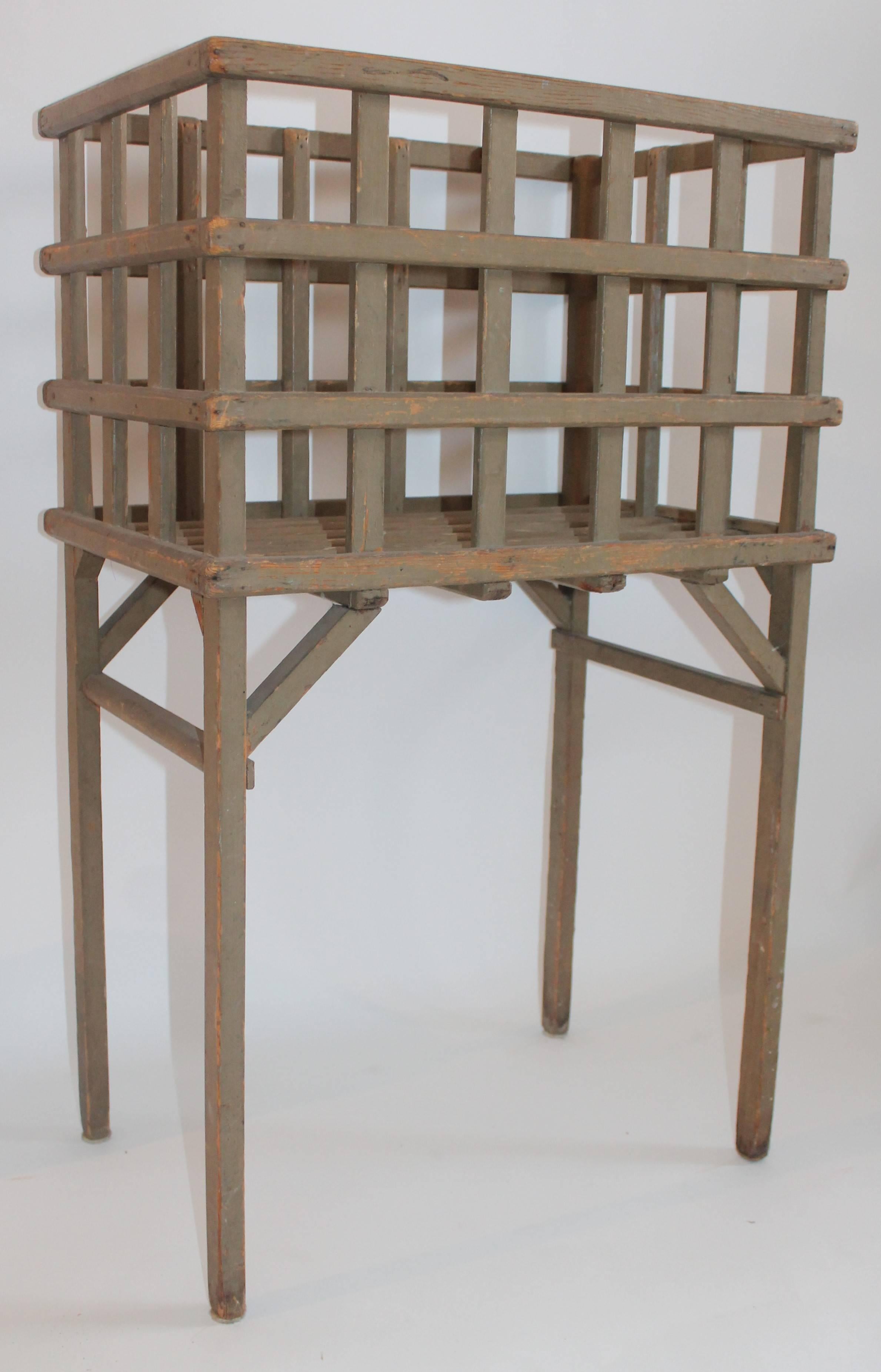 This cool sage green original lattice basket on legs is in fine condition, Great for textiles.