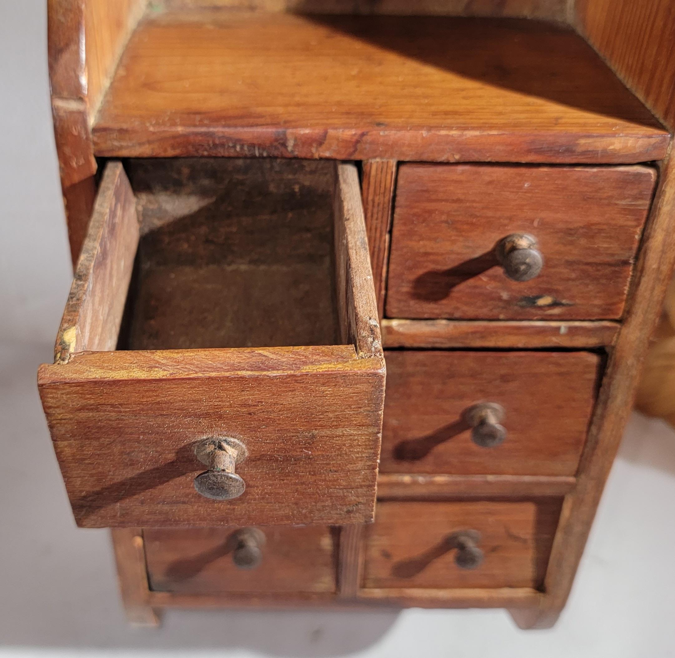 19th century Hanging wall spice box with handmade drawers and tiny drawer pulls and in fine condition.This spice box has a nice mello patina.