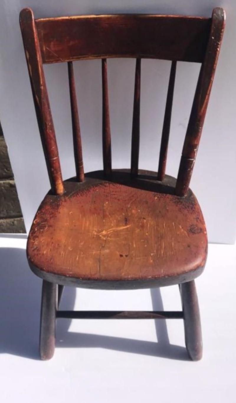 Rare form of a fantastic original red painted child's chair, circa 1860s-1870s
Original worn stencil back splash and signed in pencil Conn. on bottom seat fantastic as found condition.