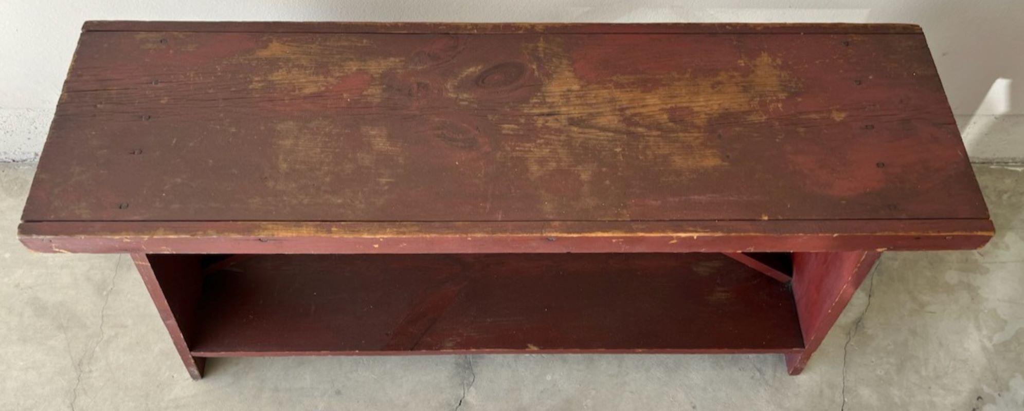  This 19thc original red painted farm bench is in fine ,sturdy condition.This bench came from Pennsylvania. 
