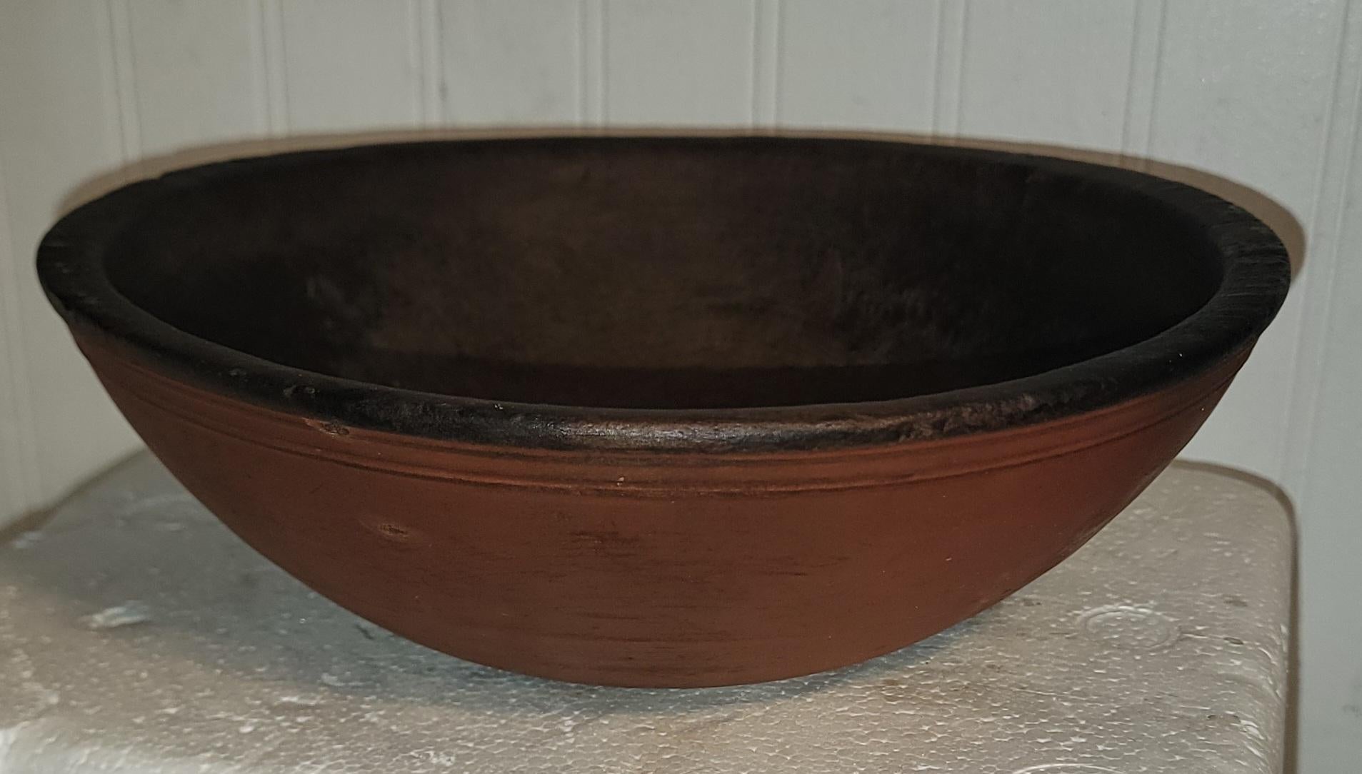 This 19thc hand turned wood bowl has original red painted surface and in very good condition.The patina is the very best.