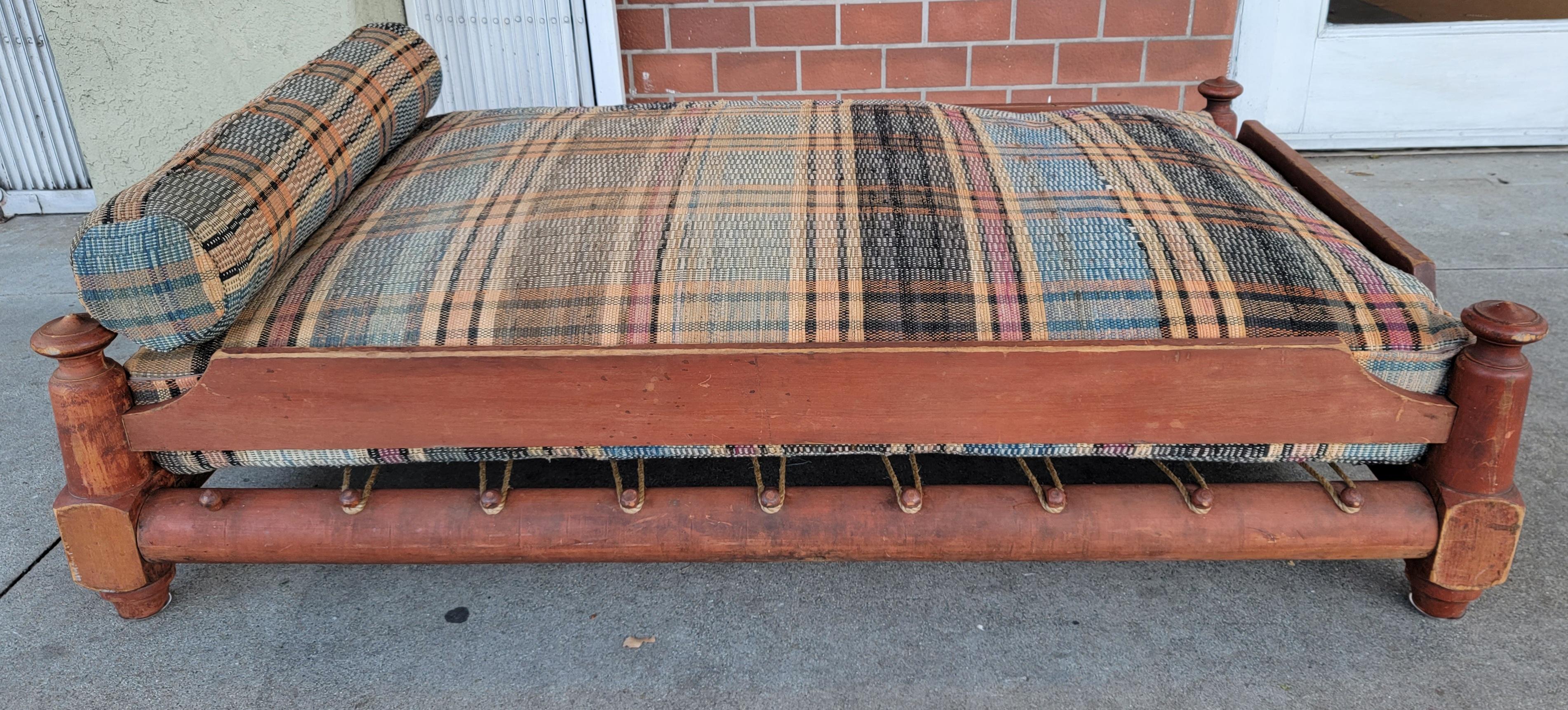 19th C Original Salmon Painted Trendle Bed W/ Rag Rug Cushion In Good Condition For Sale In Los Angeles, CA