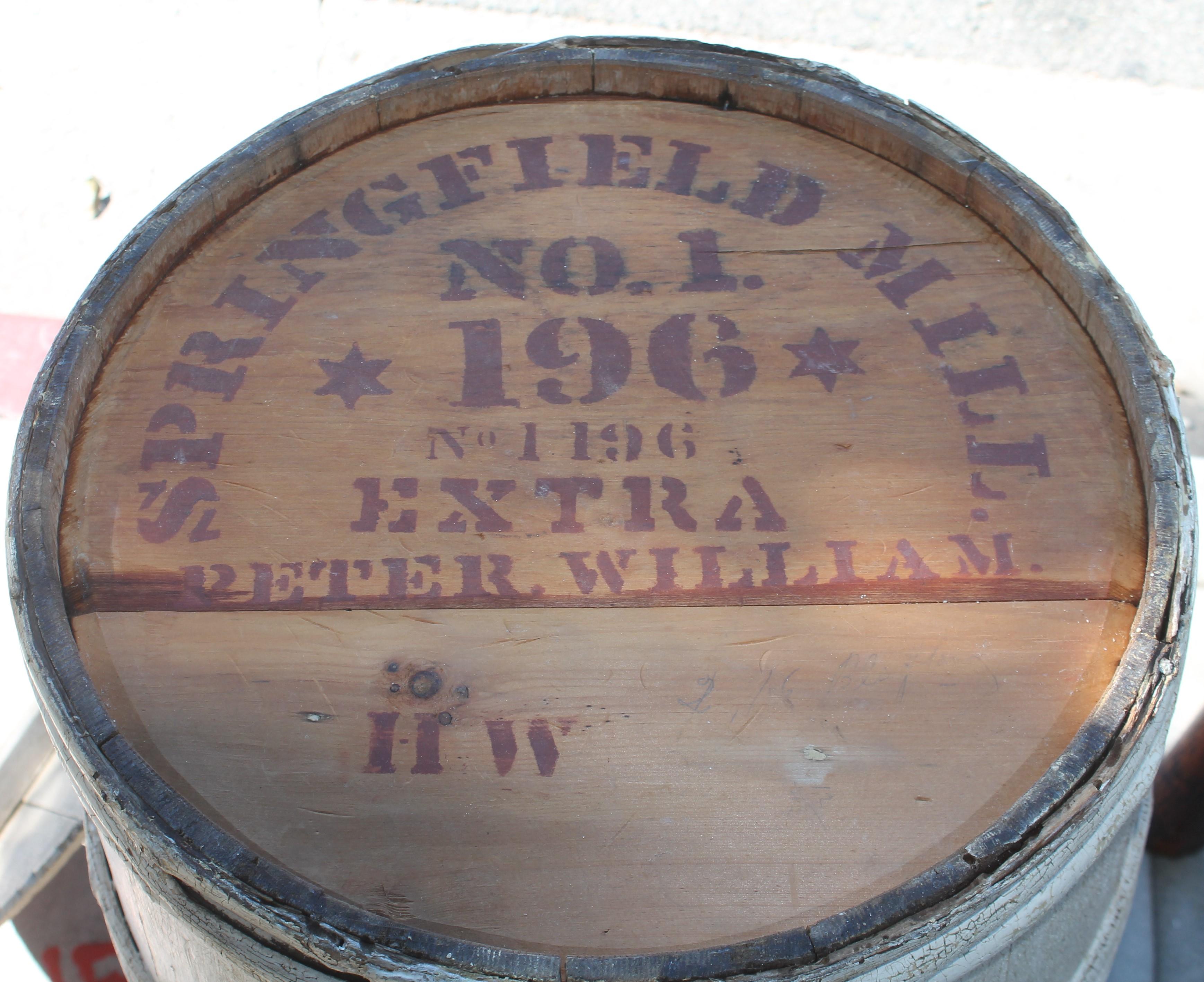 This 19thc grungy original white painted barrel made from hickory wood and wrapped with wood twigs. This barrel is stenciled 