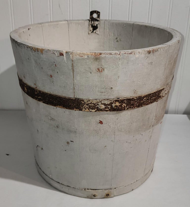 This 19thc original white over red painted sap or water bucket is in fine tight condition.Some use for collection fruit or vegetables. So cool and many different uses.