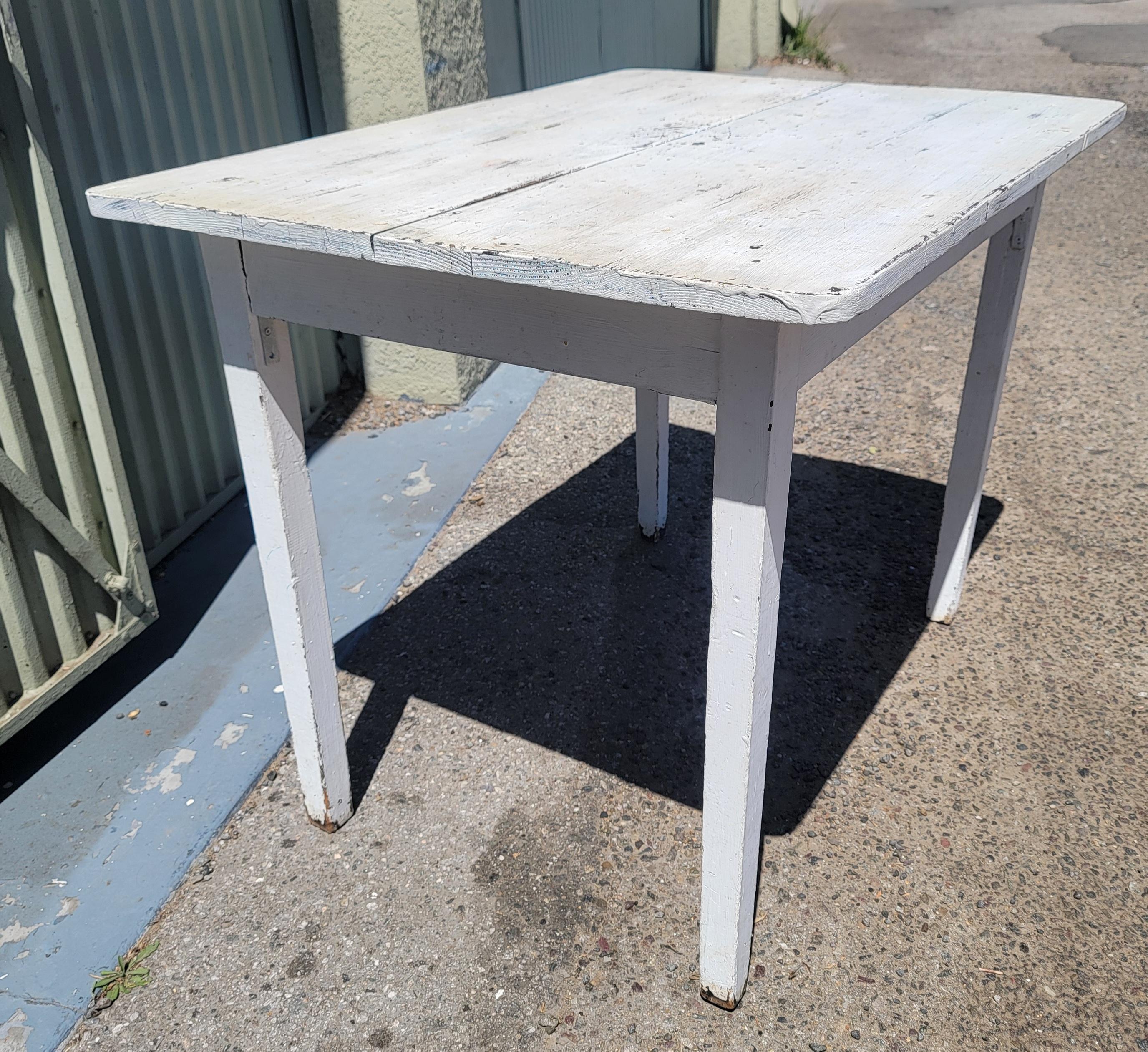 19Thc Original white painted two board top farm table from Pennsylvania in good sturdy condition.This farm table is square cut nail construction.