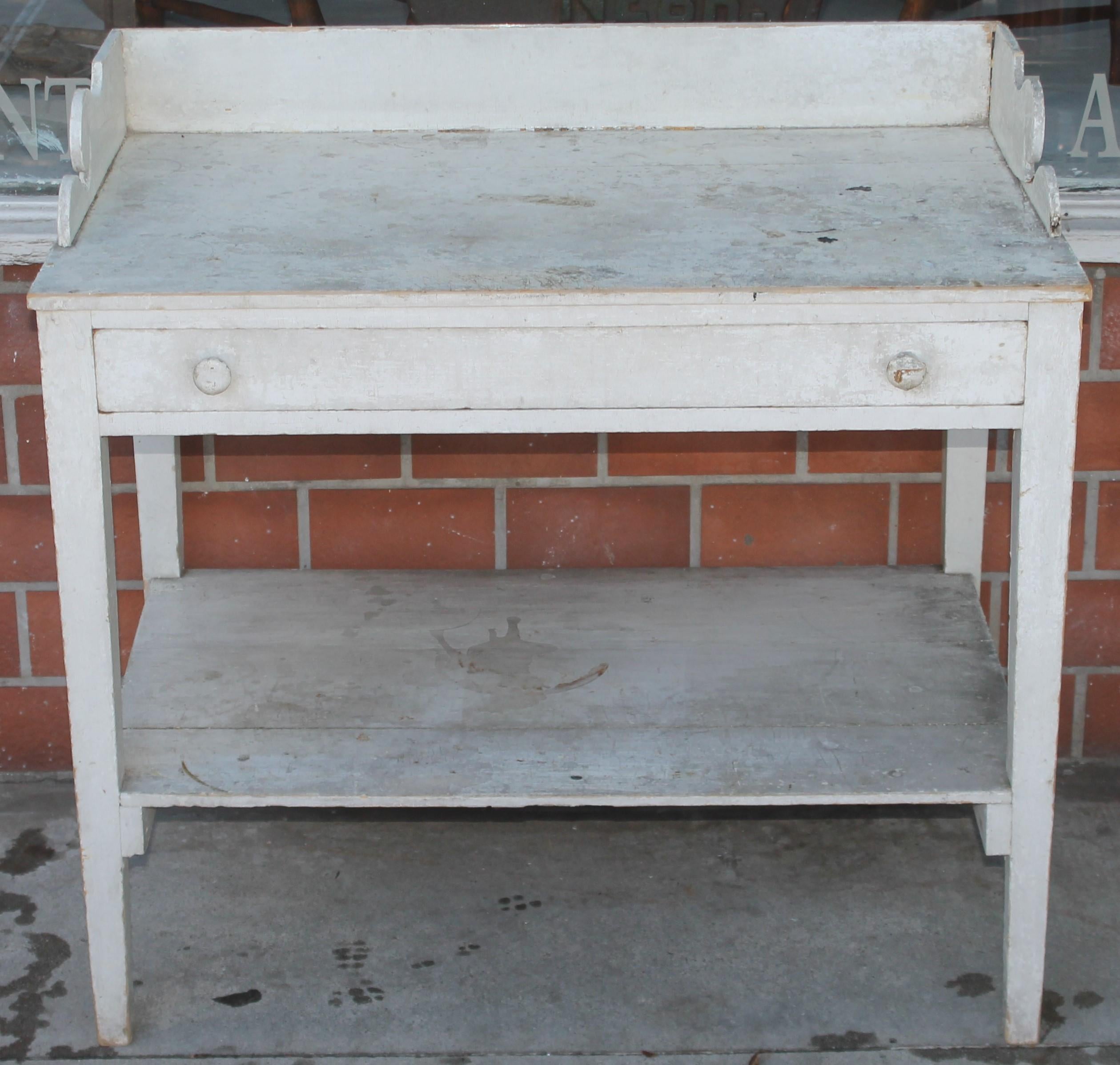 19thc Original white painted sideboard or server. This fine stand has one drawer and all original dovetailed case or splash. This is a very early sturdy table.
