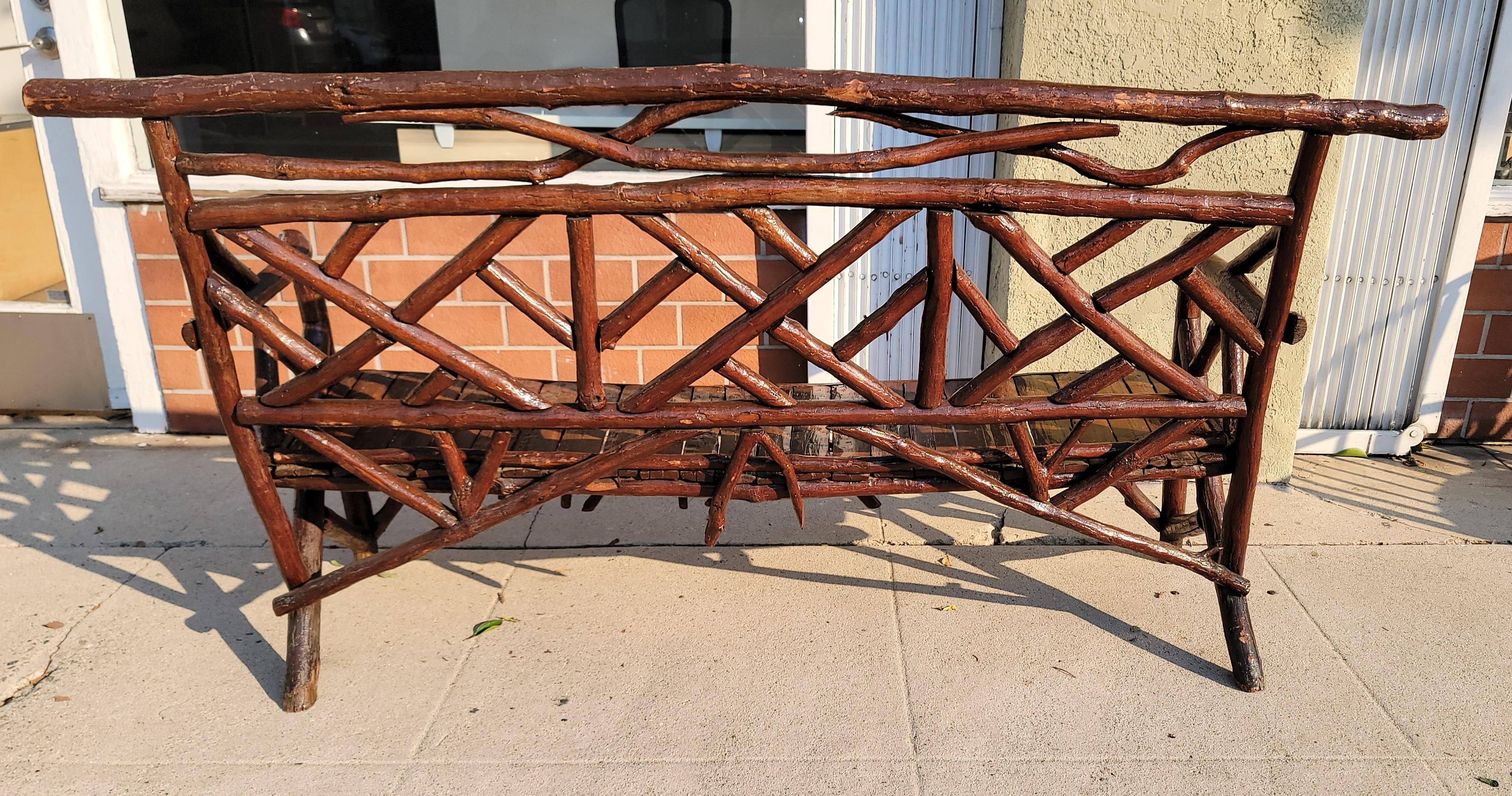 19Thc Hand Made folky twig & log settee from Pennsylvania.This settee is in fine sturdy condition.Fantastic example of folk art furniture.It was found on a farmhouse porch in Lancaster County,Pennsylvania.