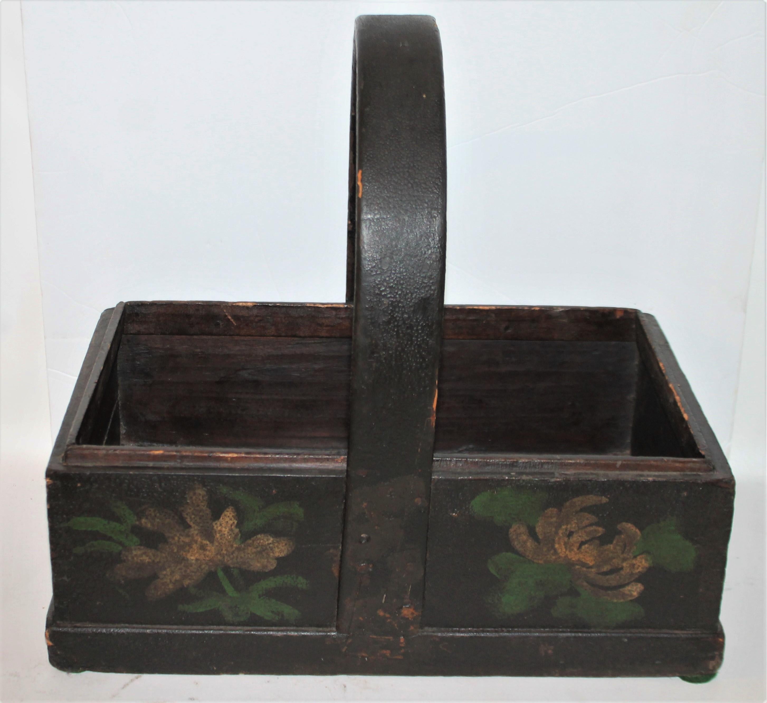 19th century handmade apple basket with original black and floral paint with original handle.
