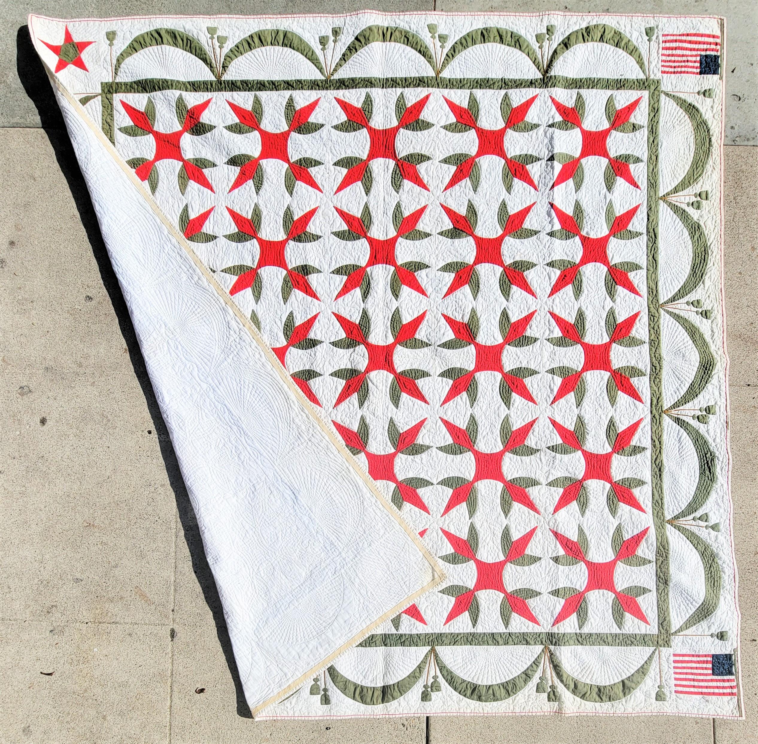 This fine early mid century patriotic applique crown of thorns variation and flags flanked in two corners is in very good condition. Comes from a private collection in Pennsylvania. Notice the appliqued red stars in the other side of the quilts