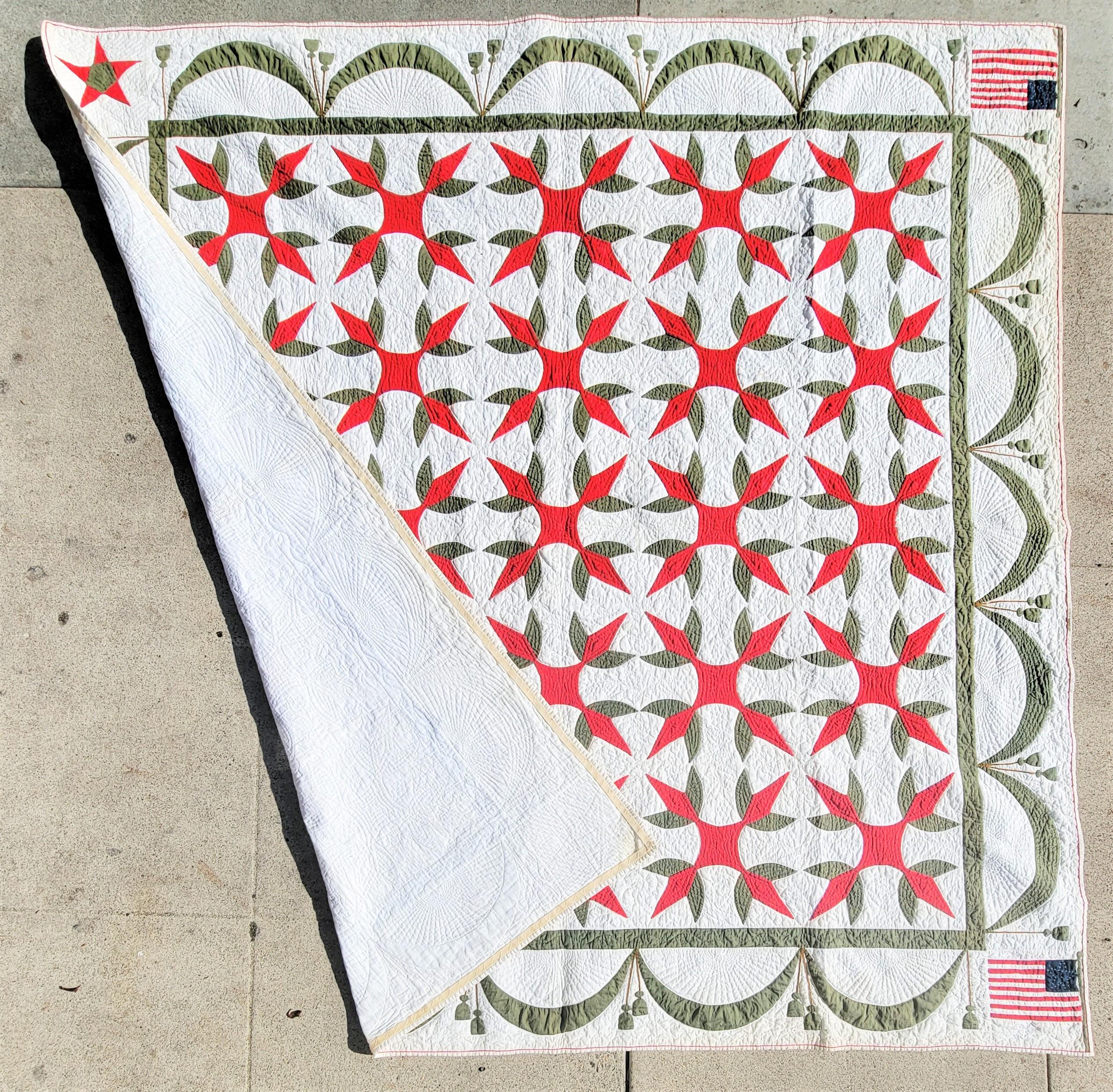 This fine early mid century patriotic applique crown of thorns variation and flags flanked in two corners is in very good condition. Comes from a private collection in Pennsylvania. Notice the appliqued red stars in the other side of the quilts