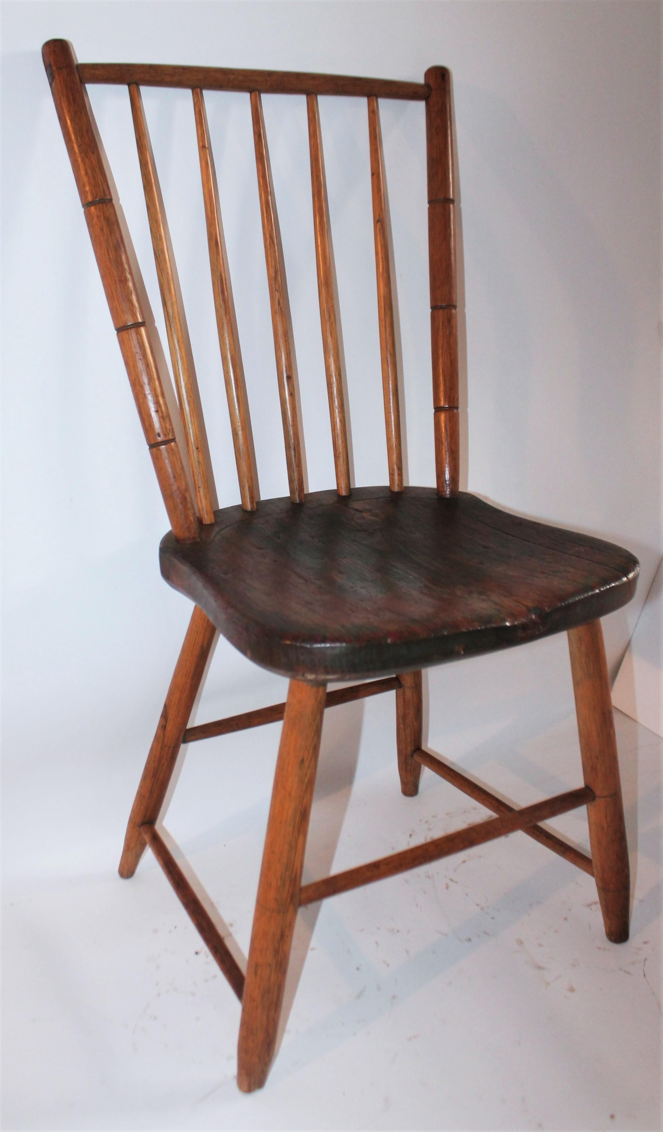 19th century Windsor with original green paint in grain. Great patina and great craftsmanship. Pennsylvania Bird Cage Windsor.