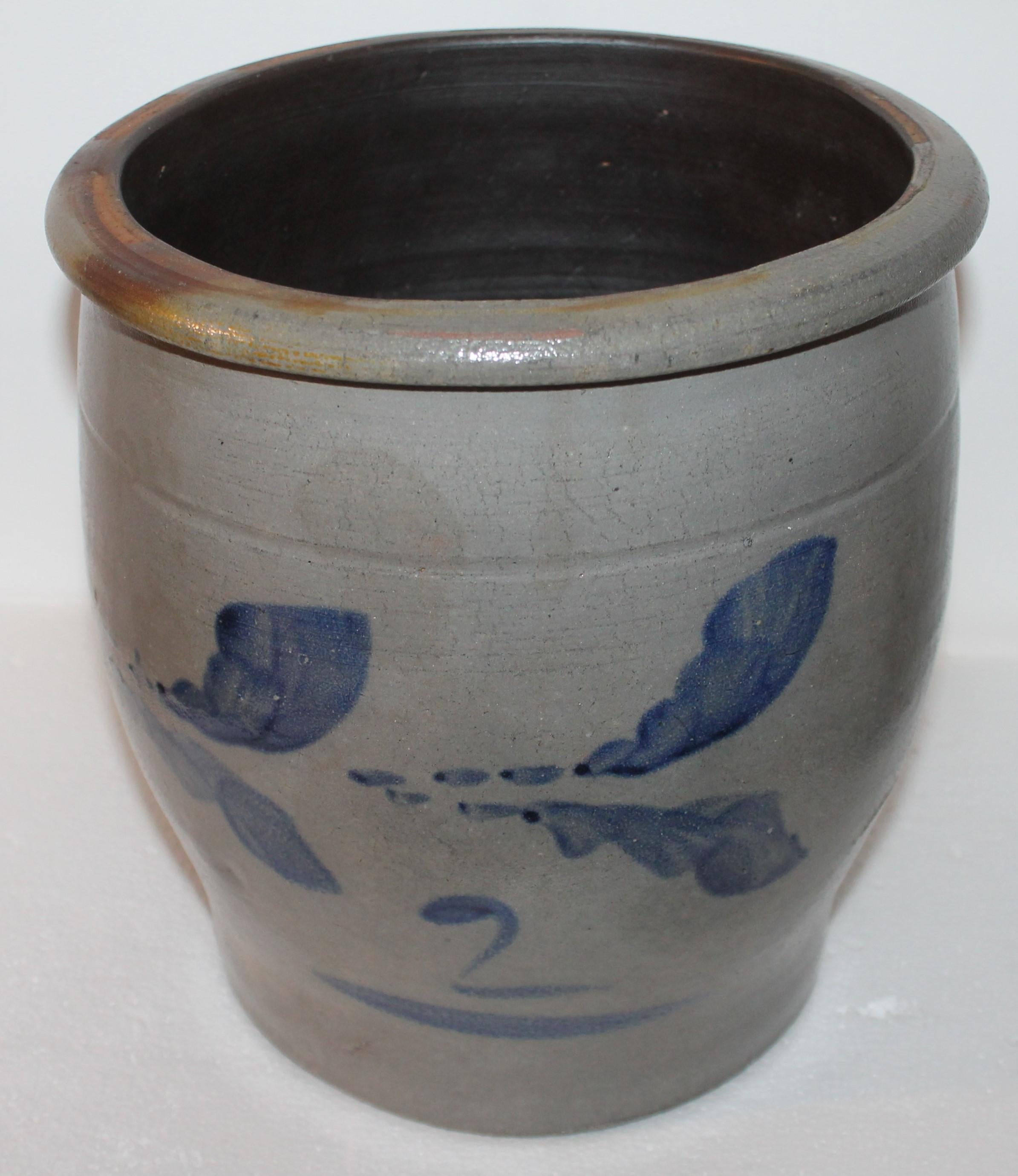 This fine blue decorated salt glaze crock in fine condition. It has stripes and a blue 2 on the front face.