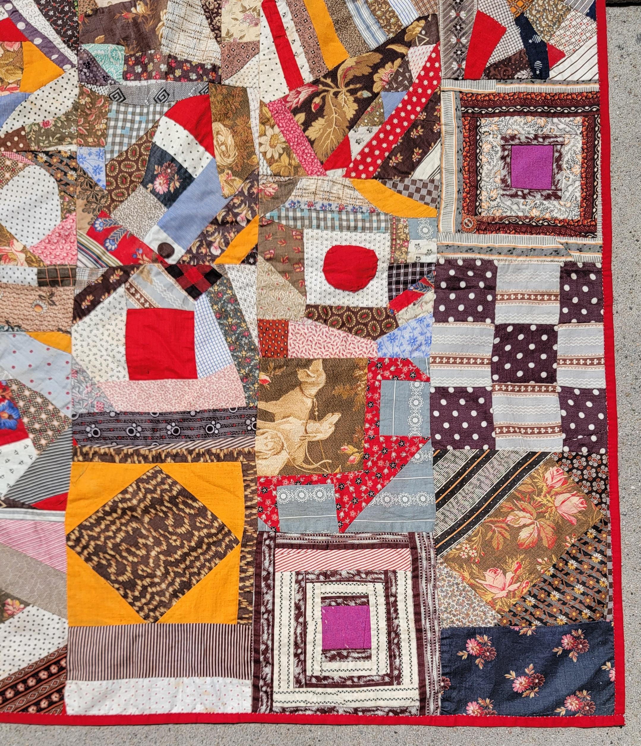 Pennsylvania crazy/ strip Quilt has all kinds of odd appliques & interesting sample patterns.Note the unusual prints and usage of fabrics. The backing is in a turkey red & tied. The condition is mint.