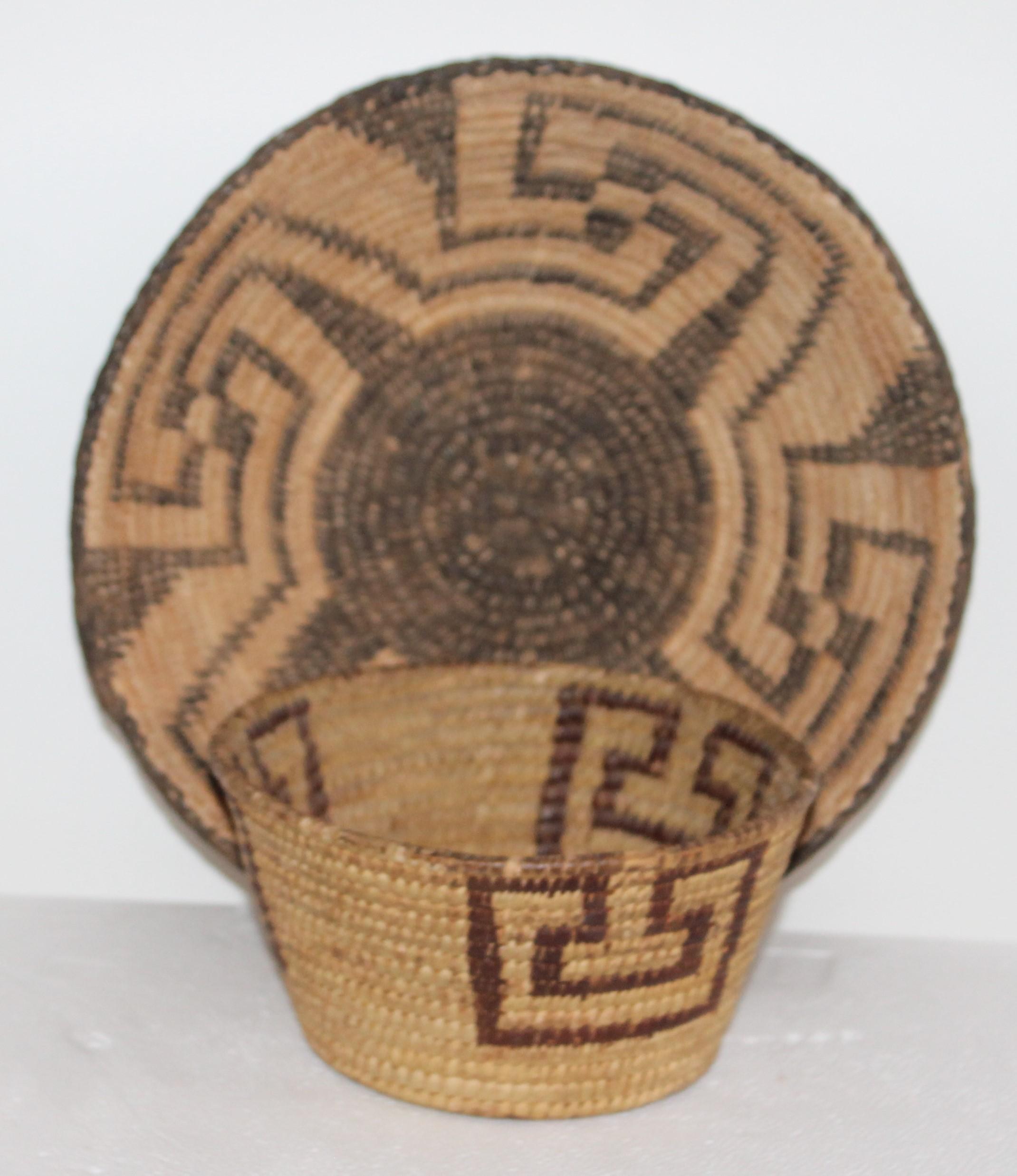 These three Pima Indian handwoven baskets are in fine condition. One large tray is in pristine condition
The second tall coil basket is geometric as well
The third smallest basket is in fine condition

Measures: Small basket 6.5 x 3.5
Large