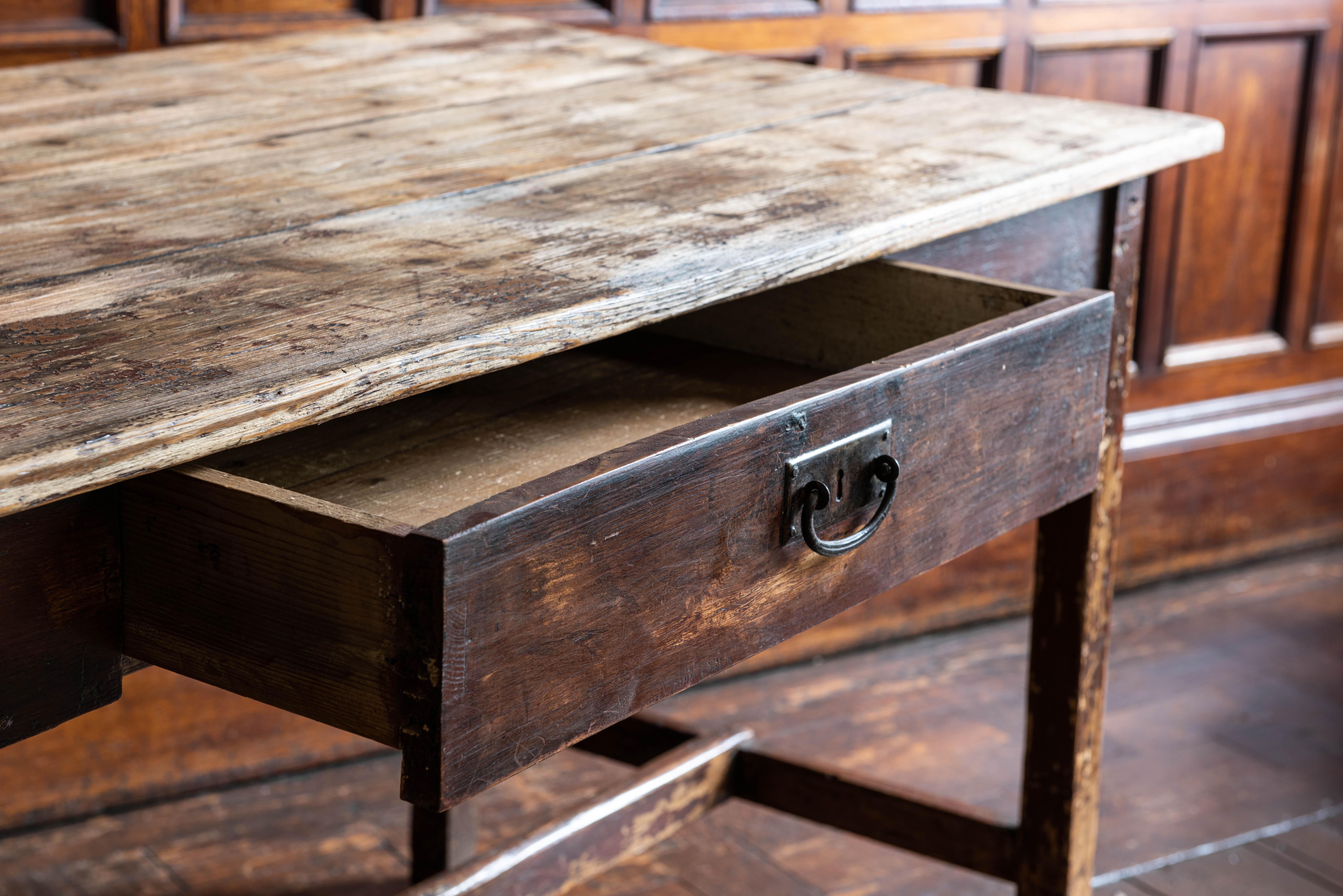 19th century pine Lancashire Mill table
Original finish in reclaimed condition with great color, wear & patination. Fantastic proportions with elegant narrow legs and stretcher

Measures: 150 W x 73 D x 80 H cm.