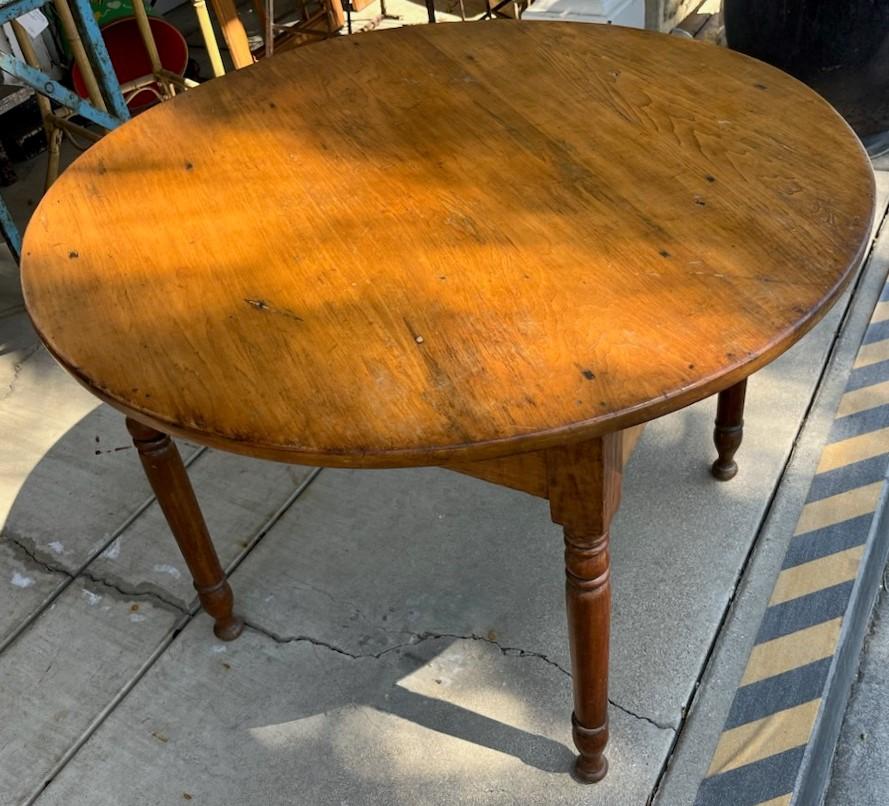 This 19th century handmade round coffee table wit turned legs is in fine and sturdy condition.What a great Size for a coffee table or side table. Wonderful aged patina.