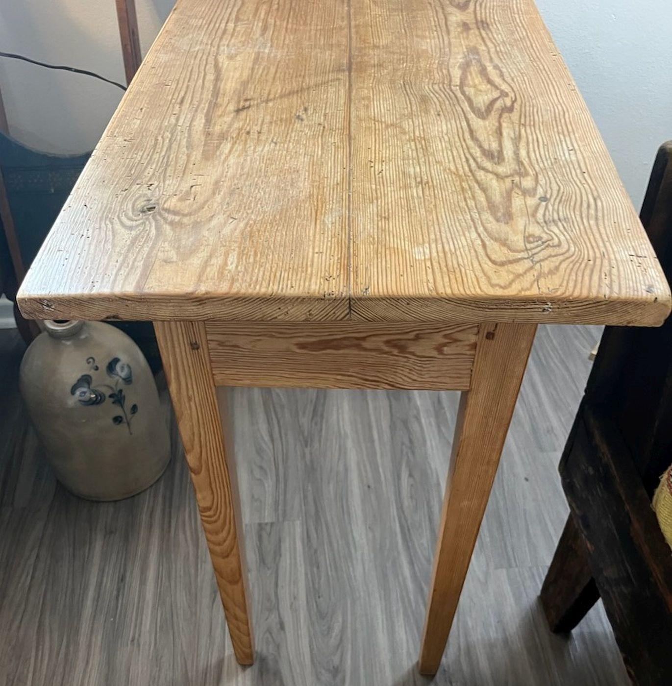19th C Pine side table with one drawer. Makes a great end table next to a sofa or bed. The condition is very good and sturdy.