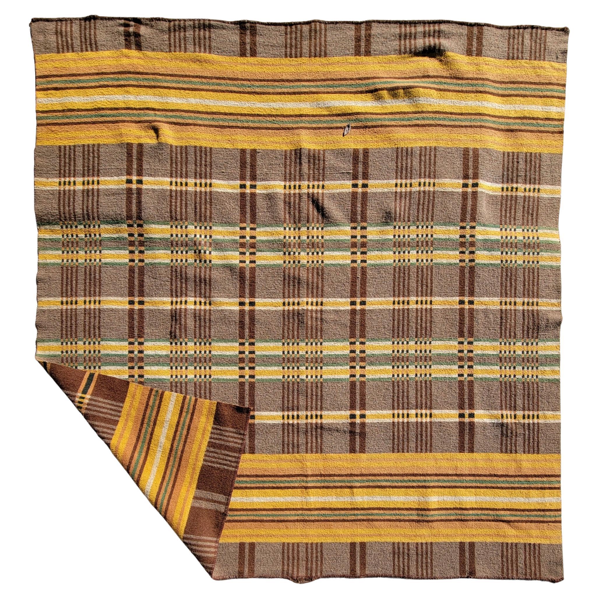 Wonderful double sided plaid blanket with great colors. Great thick yellow striped with hints of green and white. Beautiful brown background hold the colors together and offers a great background for the colors to shine through. 