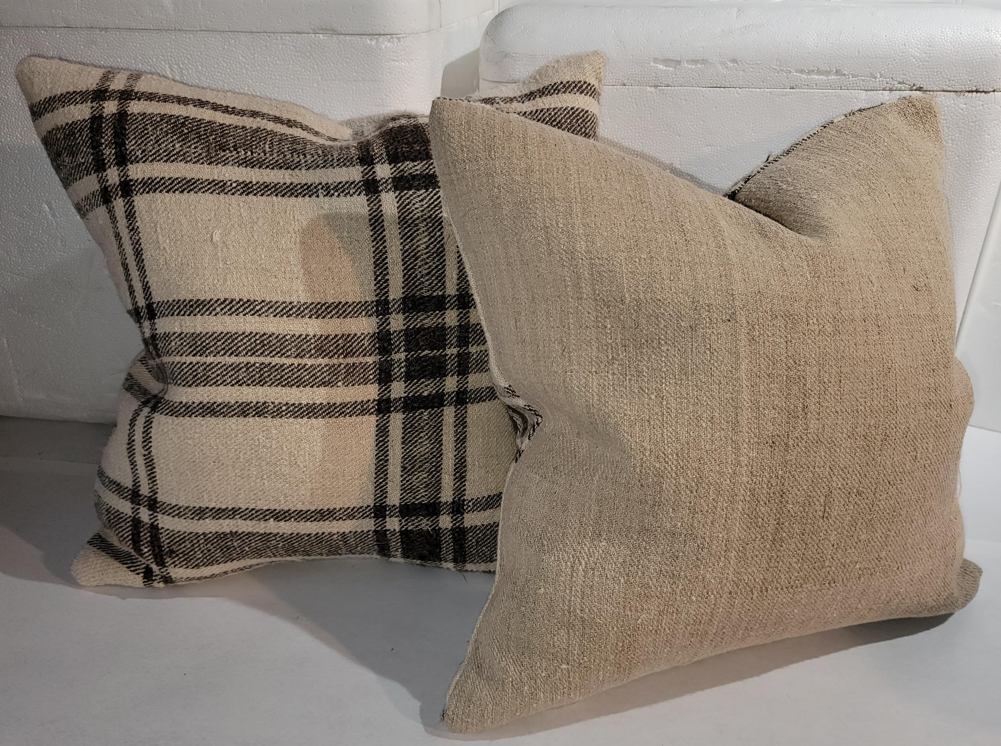 19Th century Homespun linen pillows with natural homespun linen backings.The inserts are down & feather fill.