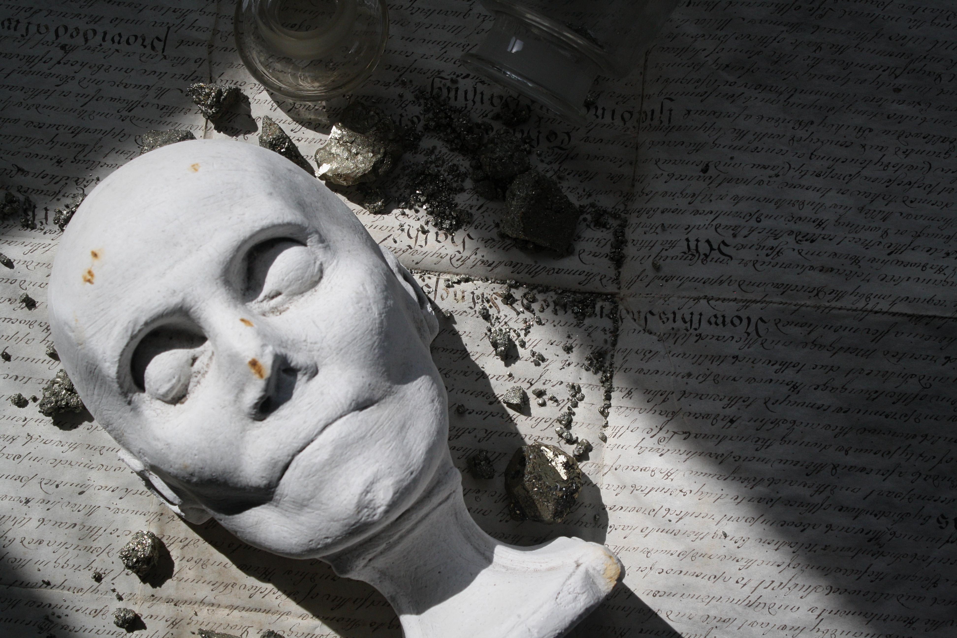 A good example of a 19th century plaster death mask on socle base. 

The subject has deep, plunging eye sockets and gaunt appearance. 

Some elderly damage to the back left section of the base, and the nose unless this was a deformity of the