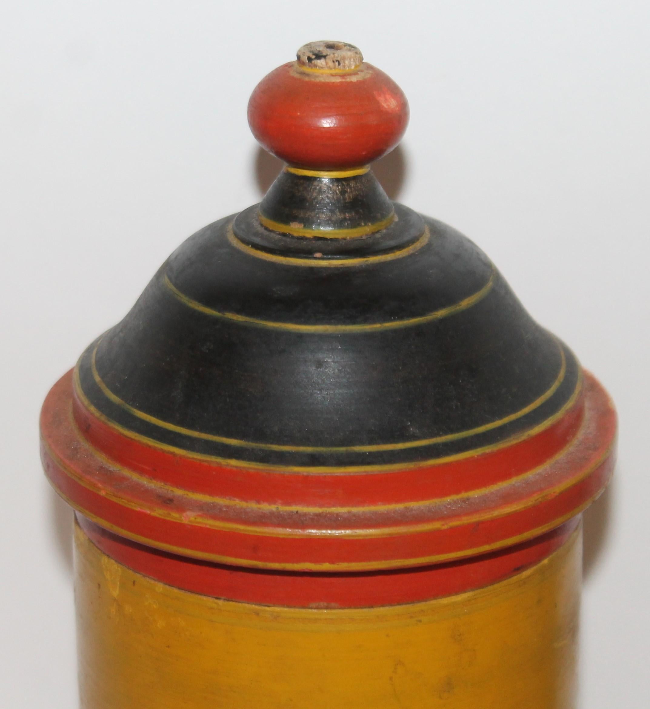 19th century polychrome painted and hand carved wood canister. This was found in New England.