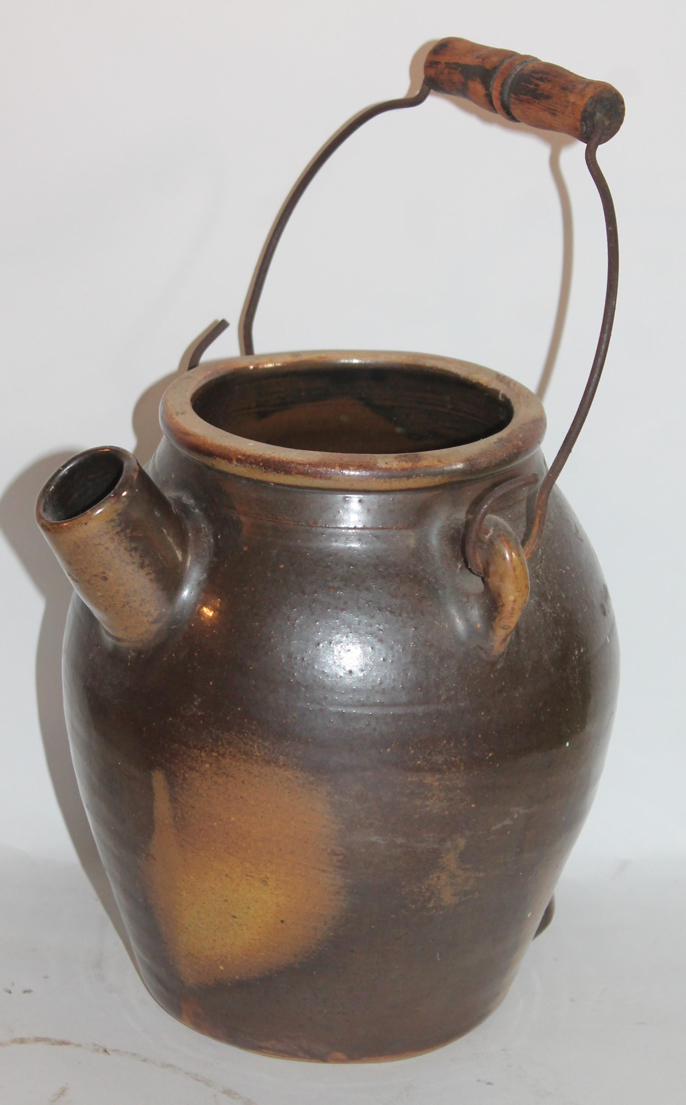 19th century pottery batter jugs with original wire and wood handles from Pennsylvania in fine condition.
Measures: 7 D x 8 W x 9 H brown
8 D x 8.5 W x 8.5 H black.