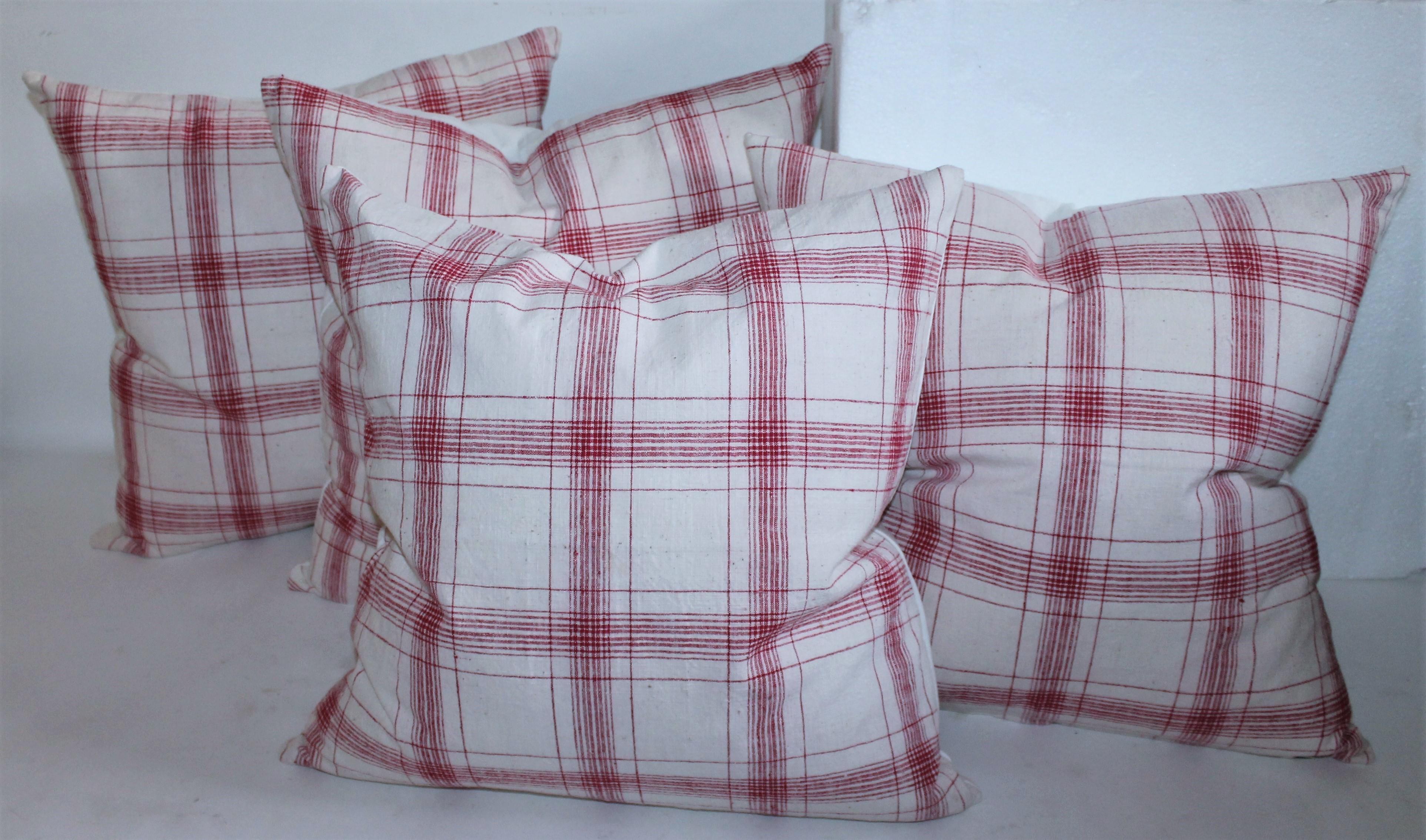 19th century red and white striped home spun linen pillows. Great condition with down and feather inserts. Sold as in a set of Four.