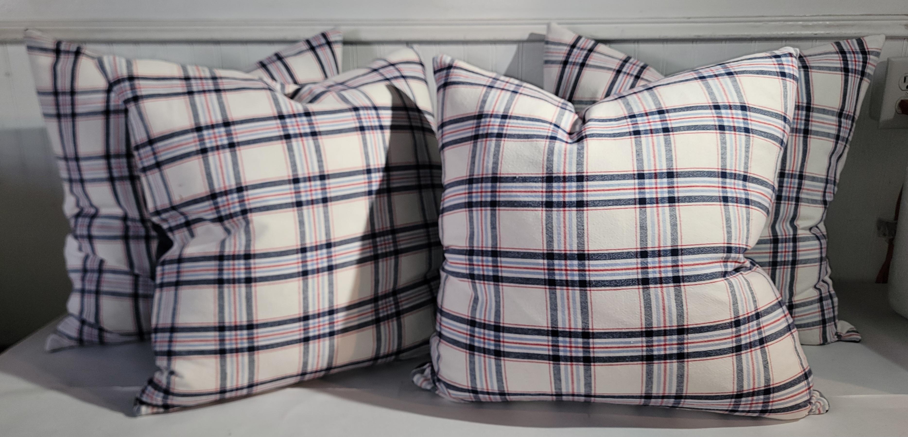These amazing 19thc plaid red /white & blue linen pillows have a fine blue linen backing.The inserts are down & feather fill.Sold as a collection of four.