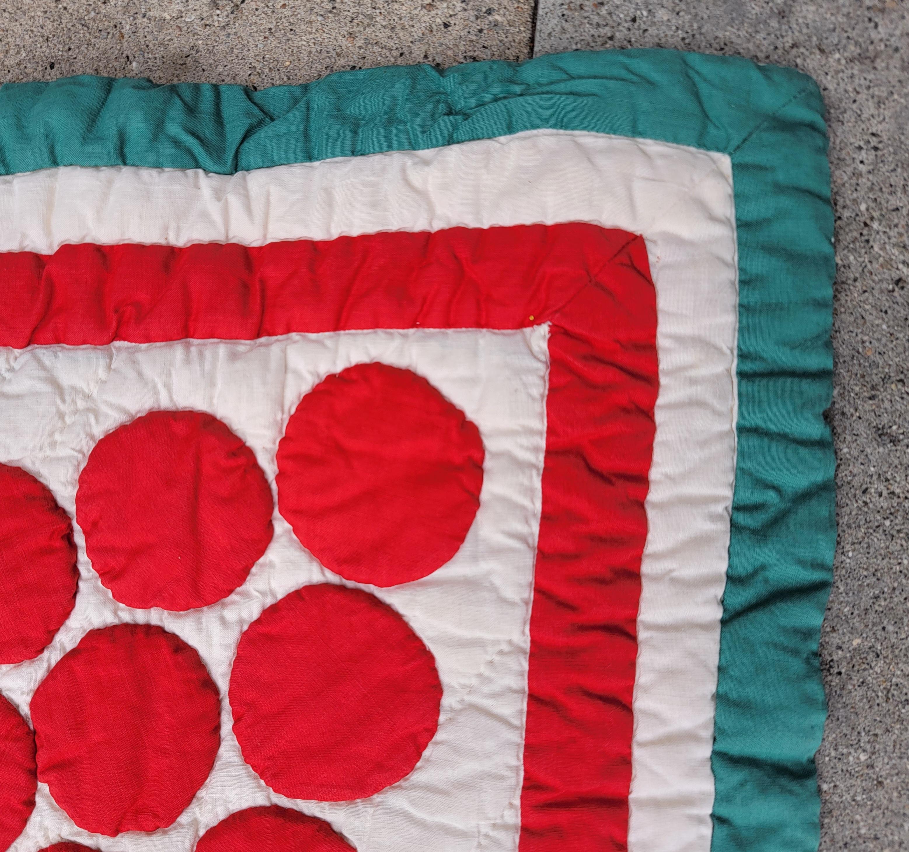 19th C Applique red & green berries quilt with red & green borders. The quilt is very geometric and in fine condition.