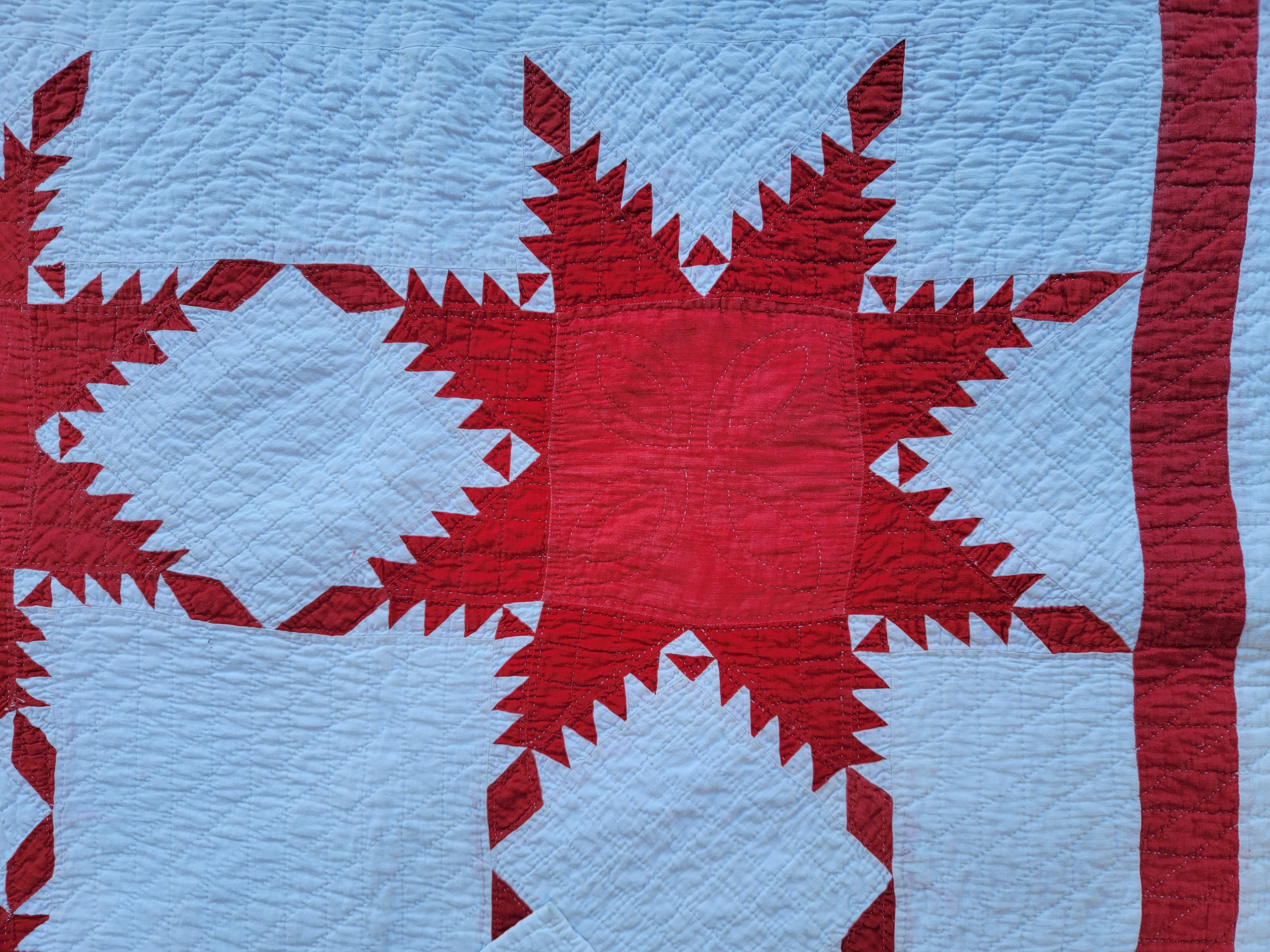 19Thc Red & white feathered star quilt in fine condition and very nice condition. This quilt was found in Ohio.