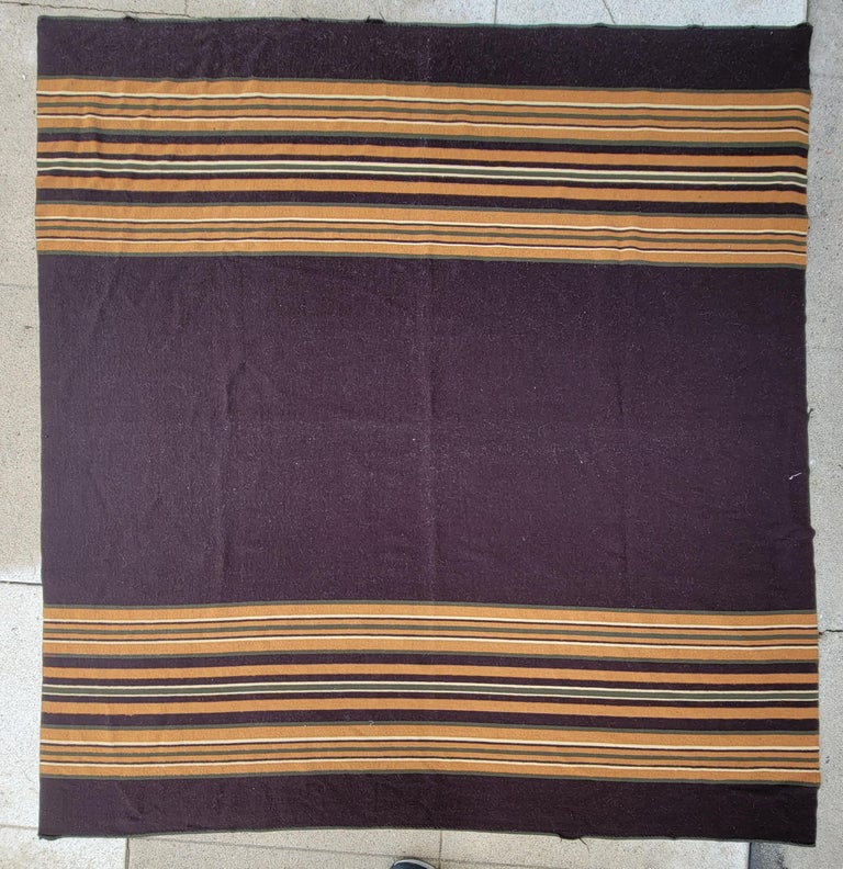 19Thc All wool striped horse blanket from Ohio is fine condition.This blanket is totally reversible with one side in brown & tans and the other side is in reds & khaki greens.The condition is amazing with hand stitched edge.