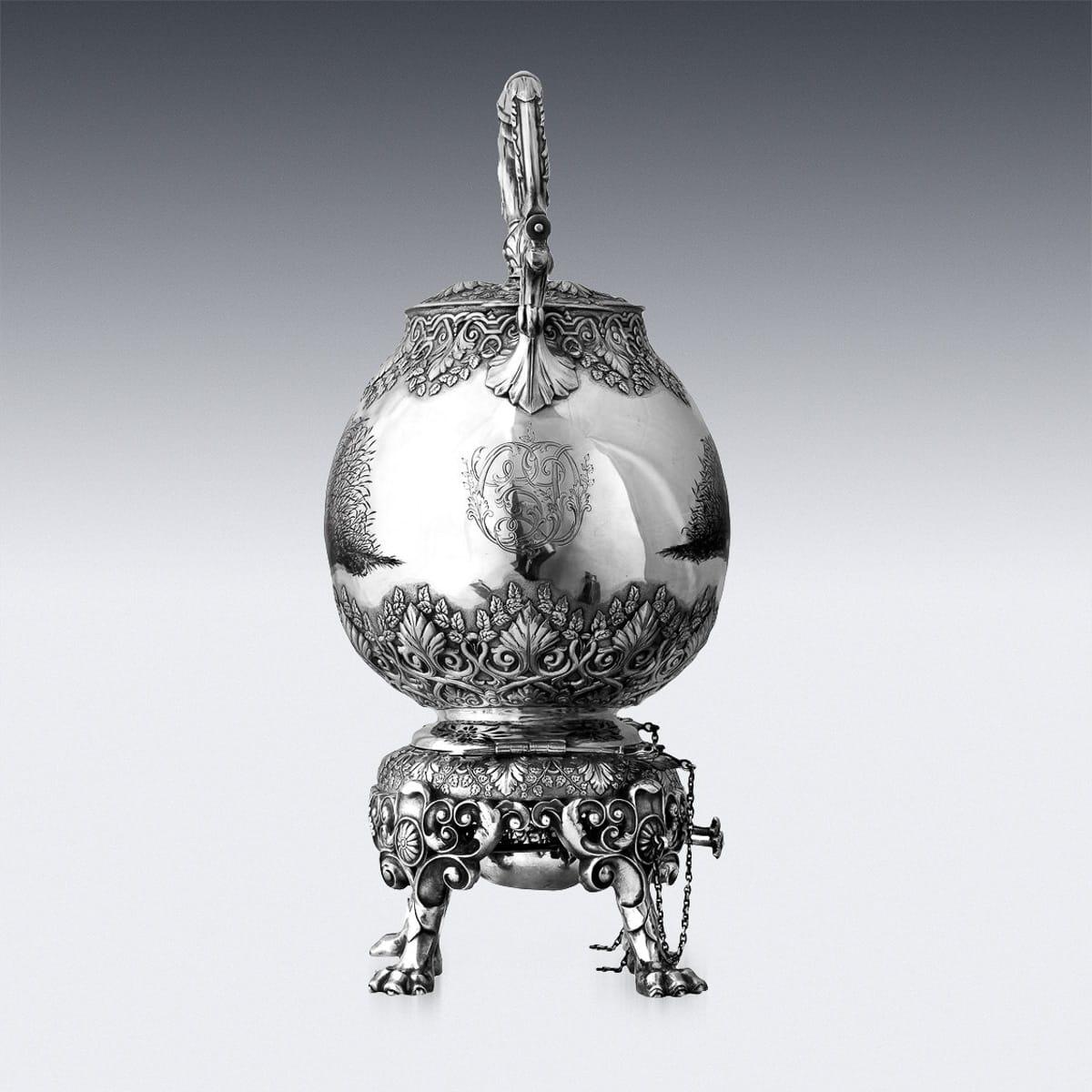 Antique 19th century imperial Russian rare solid silver and enamel tea kettle on stand, the bullet shaped body chased with leave and scrolled decoration, standing on four cast lion paw feet, mounted with a scroll shaped swing handle and leaf capped